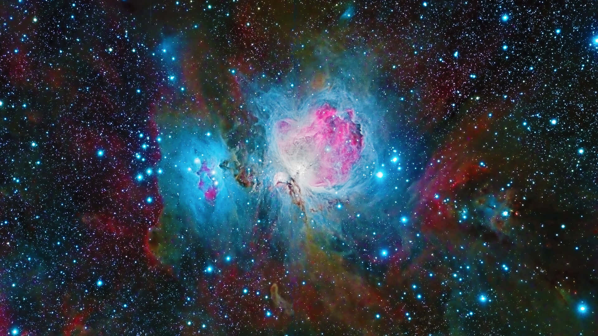 銀河 桌布 壁紙 — 一個充滿活力的宇宙星雲，在深空的星場中散發著粉紅色和藍色的色調。
