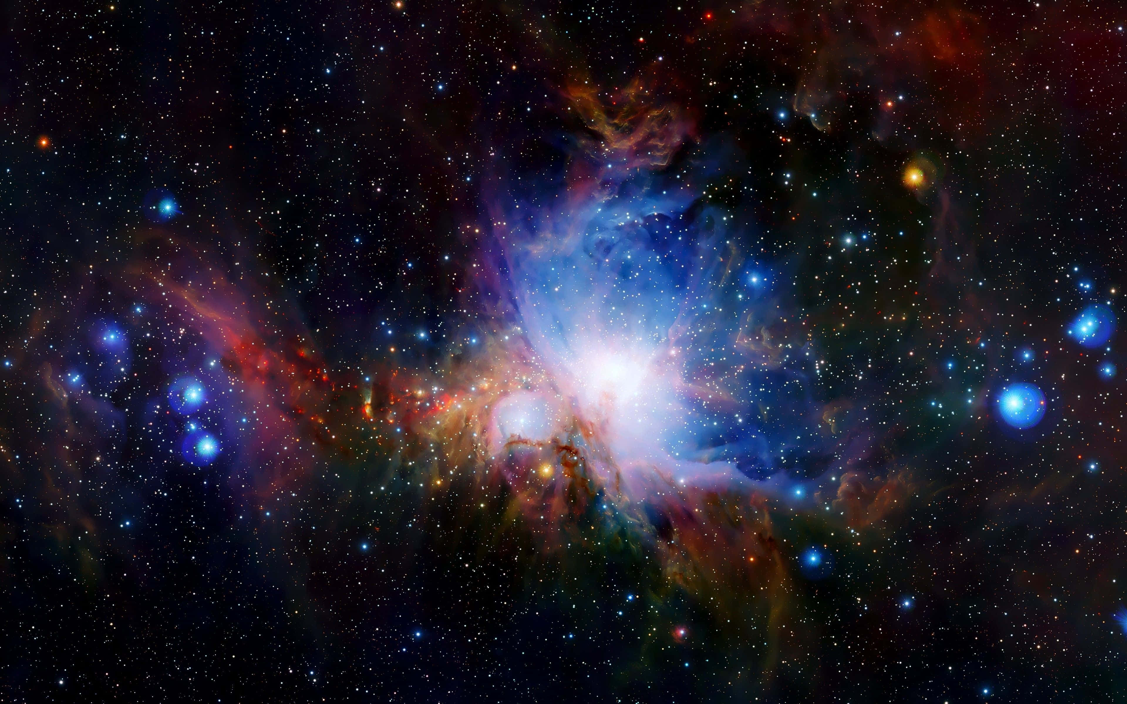 Space Nebula 桌布 壁紙 — 一個充滿活力的宇宙星雲，在深空的星場中爆發出藍色、紅色和橙色的氣體。