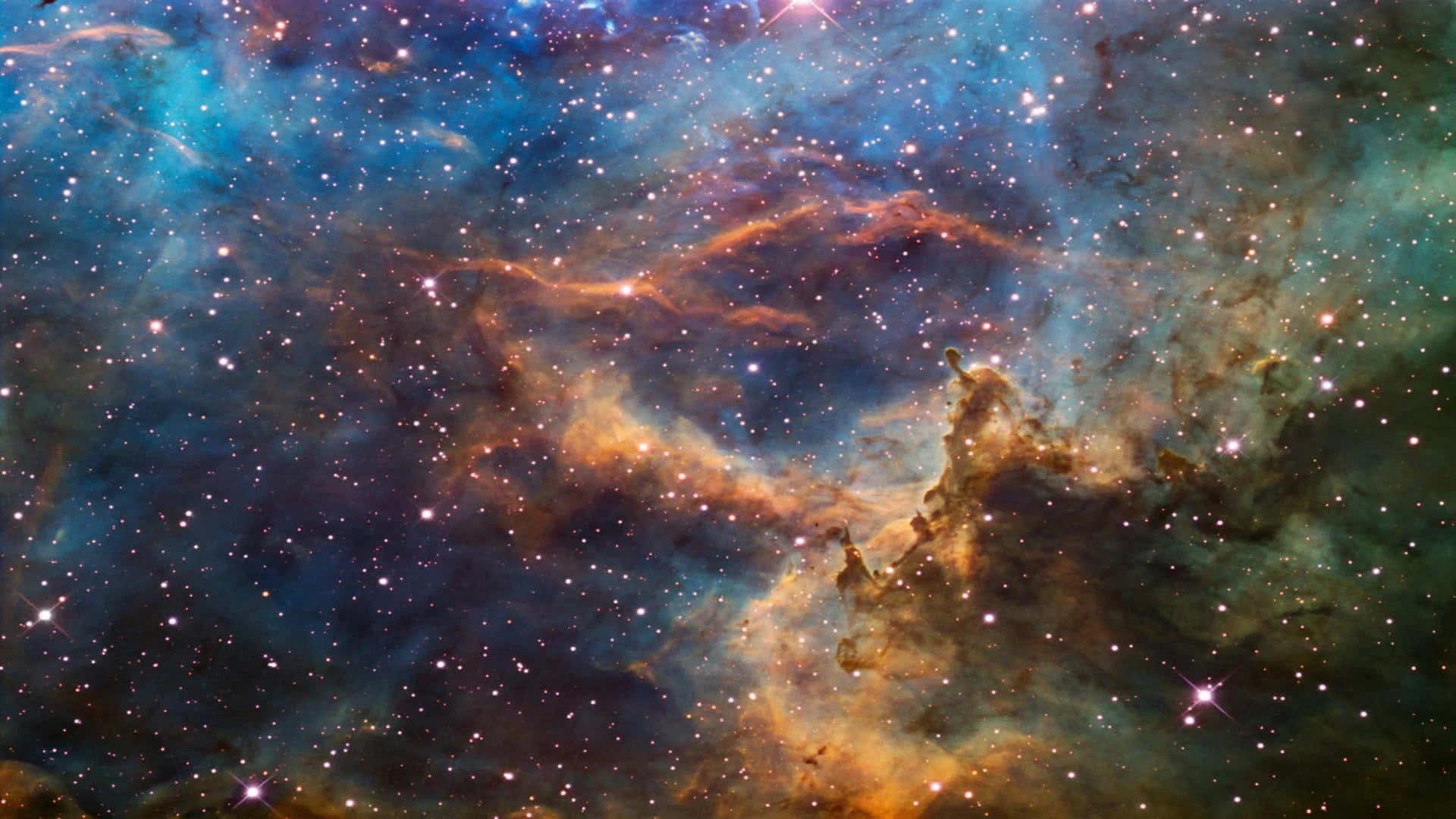 Real Space 桌布 壁紙 — 一個充滿活力的宇宙星雲，在深邃太空背景下，旋轉著發光的橙色和藍綠色氣體雲，點綴著閃爍的星星。