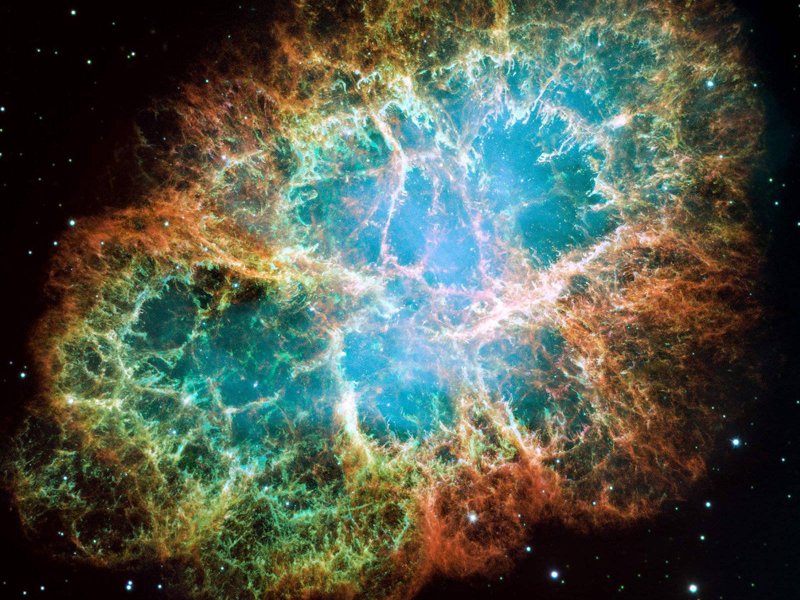 太空 桌布 壁紙 — 一個充滿活力的宇宙星雲，在繁星點點的黑色虛空中，散發著發光的青綠色和橙色絲狀物。