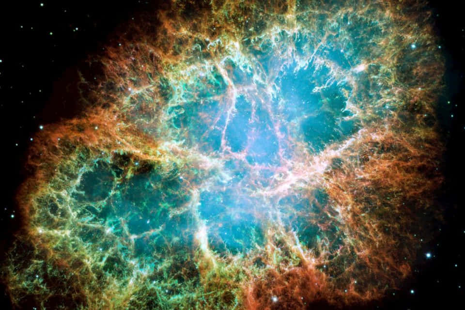 外太空 桌布 壁紙 — 一個充滿活力的宇宙星雲，在繁星點點的黑色虛空中，有漩渦狀的藍綠色和橙色氣體。