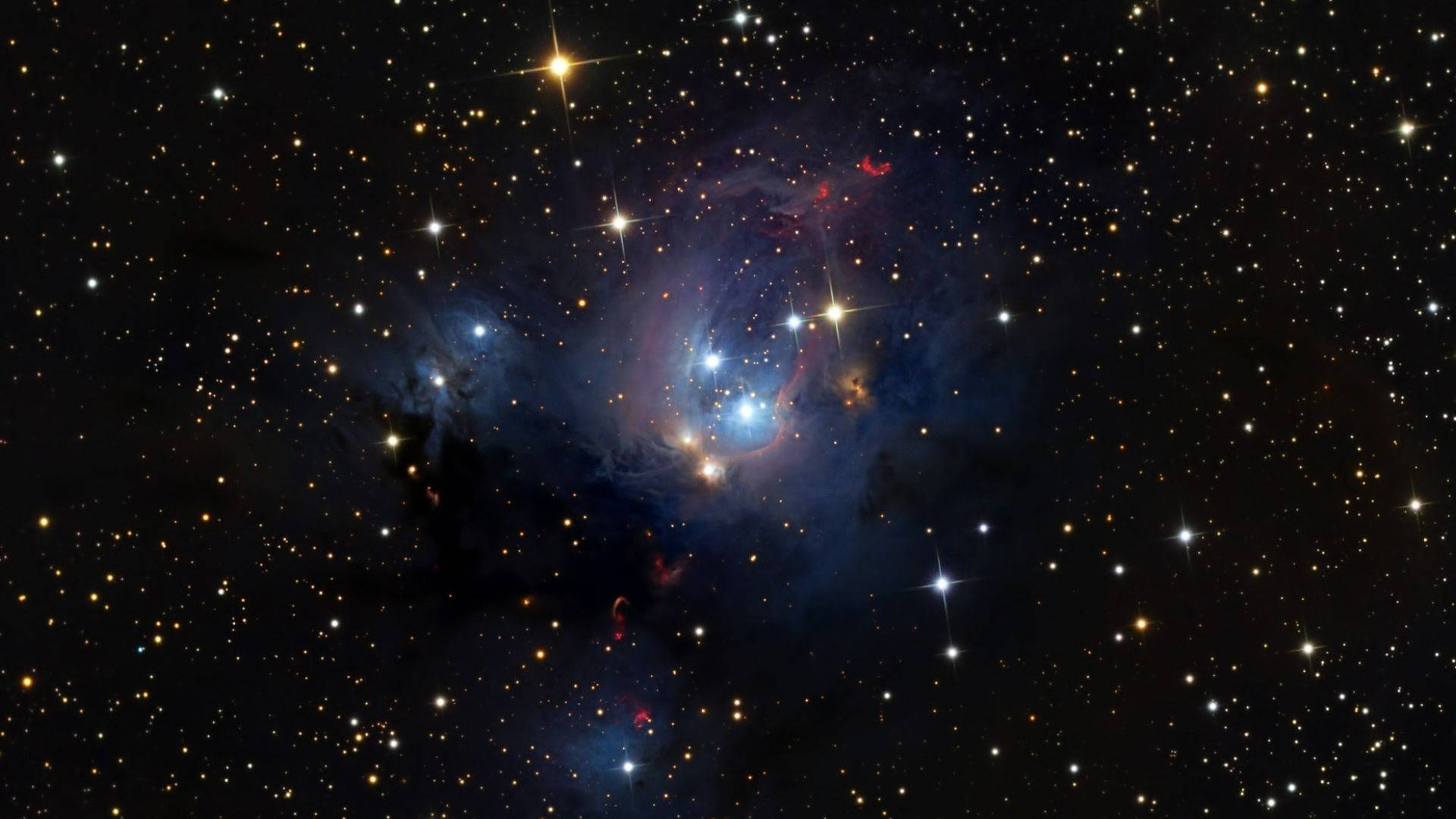 Star Space 桌布 壁紙 — 一個充滿活力的宇宙星雲，散發著藍色和紅色的色調，被無數閃爍的星星包圍，背景是深邃的黑色虛空。