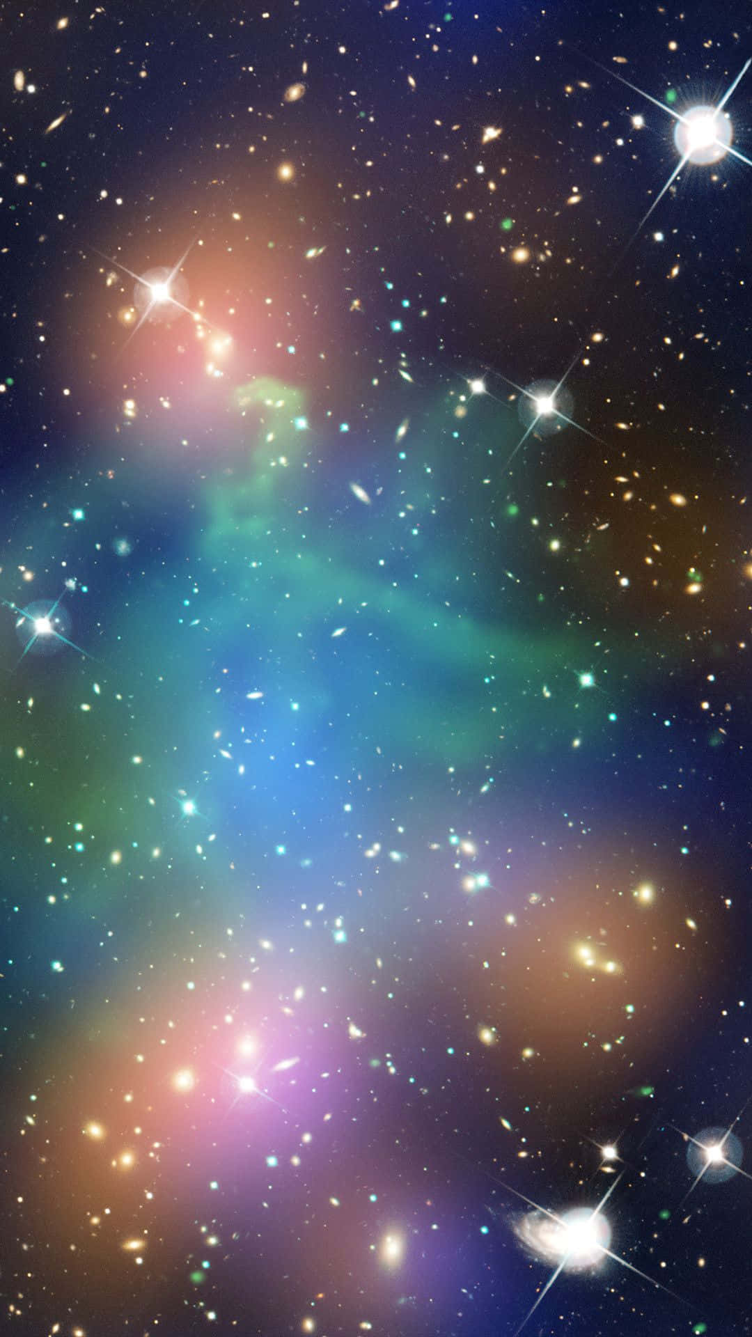 銀河 桌布 壁紙 — 一個充滿活力的宇宙星雲，旋轉著發光的藍色、綠色和粉紅色，背景是閃爍的星空。
