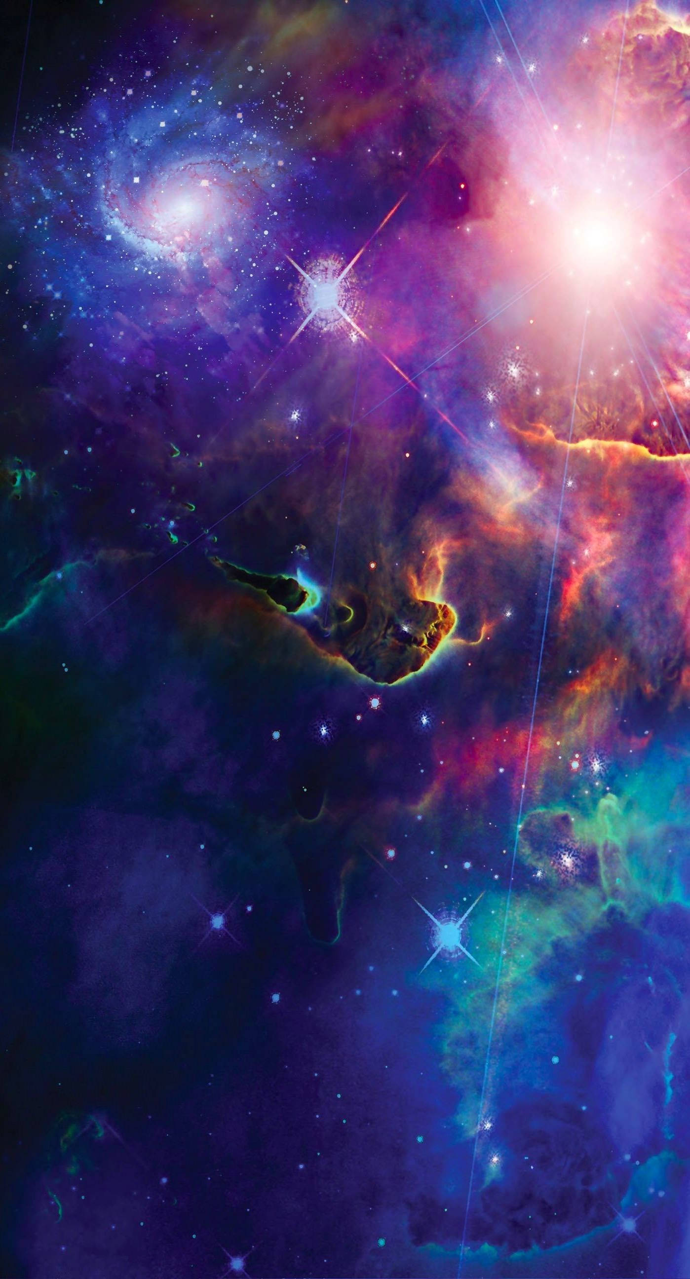 酷炫星系 桌布 壁紙 — 一個充滿活力的宇宙星雲，旋轉著紫色、藍色和粉紅色的雲層，由明亮的星星和發光的氣體結構照亮。