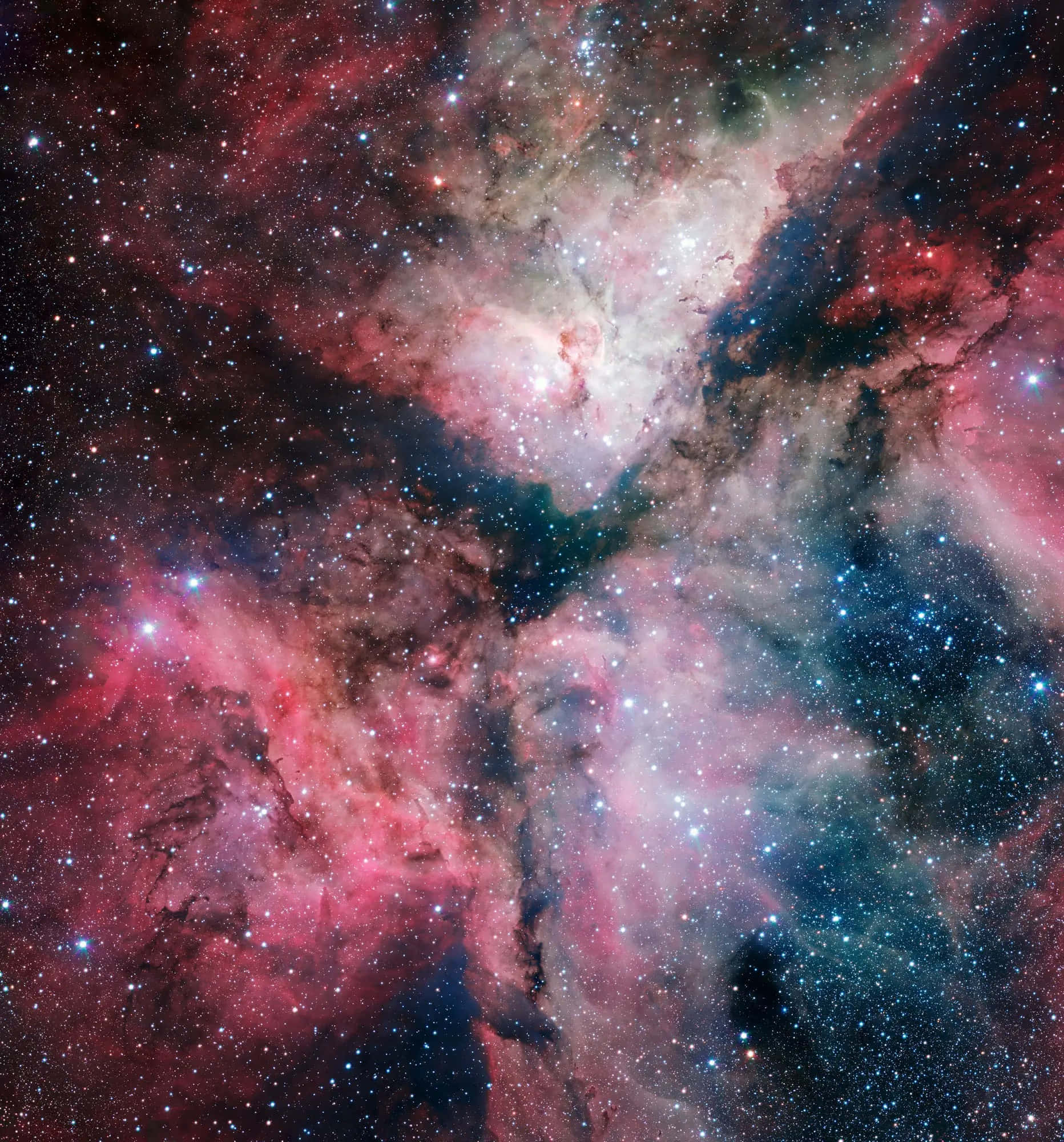 Carina Nebula 桌布 壁紙 — 一個充滿活力的宇宙星雲，粉紅色、紅色和藍色的氣體和塵埃雲旋轉，點綴著無數閃爍的星星。
