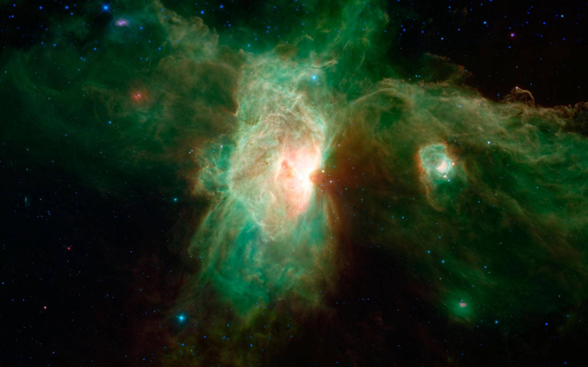 NASA 動態圖片 桌布 壁紙 — 一個充滿活力的宇宙星雲在深空的星場中發出翠綠和橙色的光芒。