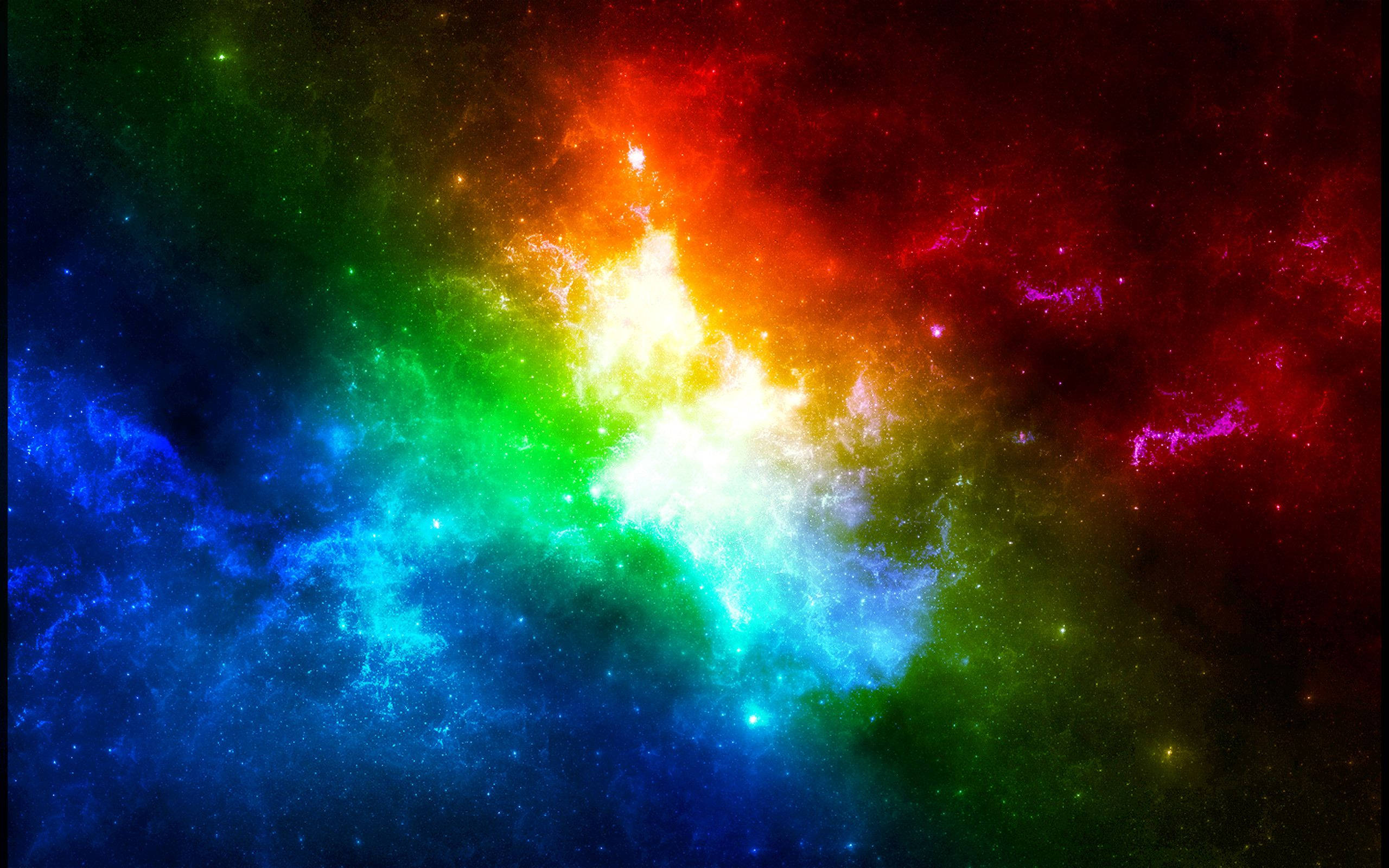 彩色動圖 桌布 壁紙 — 一個充滿活力的宇宙星雲在繁星點點的虛空中綻放出彩虹般的色彩。