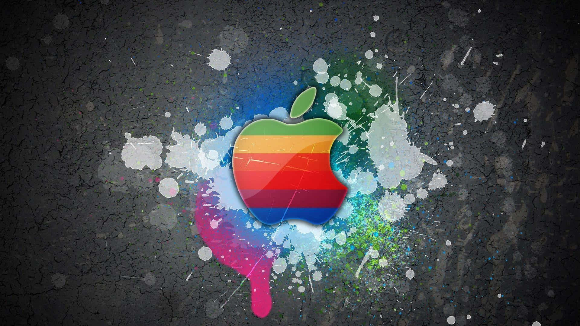 Rock 桌布 壁紙 — 一個充滿活力的彩虹Apple標誌在裂開的深色背景上爆發出色彩繽紛的油漆飛濺。