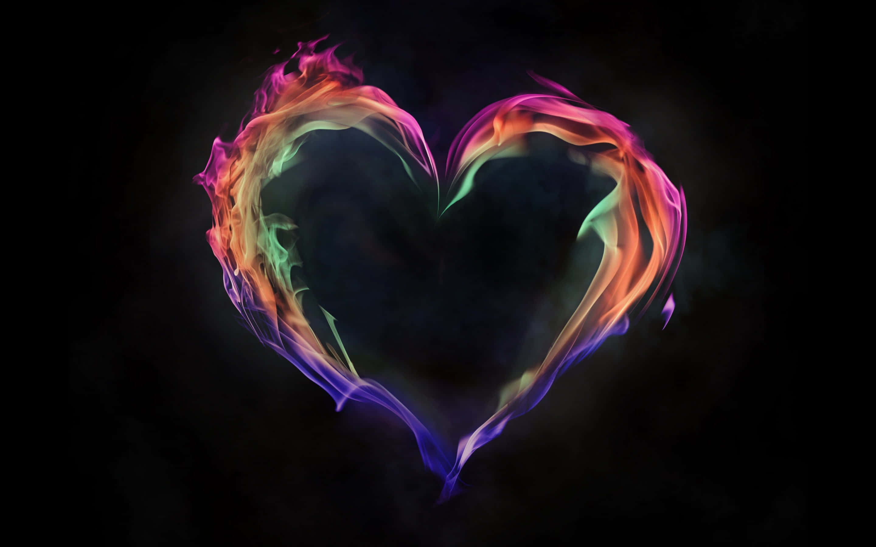 Aesthetic Heart 桌布 壁紙 — 一個充滿活力的彩虹火焰心臟在黑暗煙霧背景中發光，邊緣有旋轉的彩色。