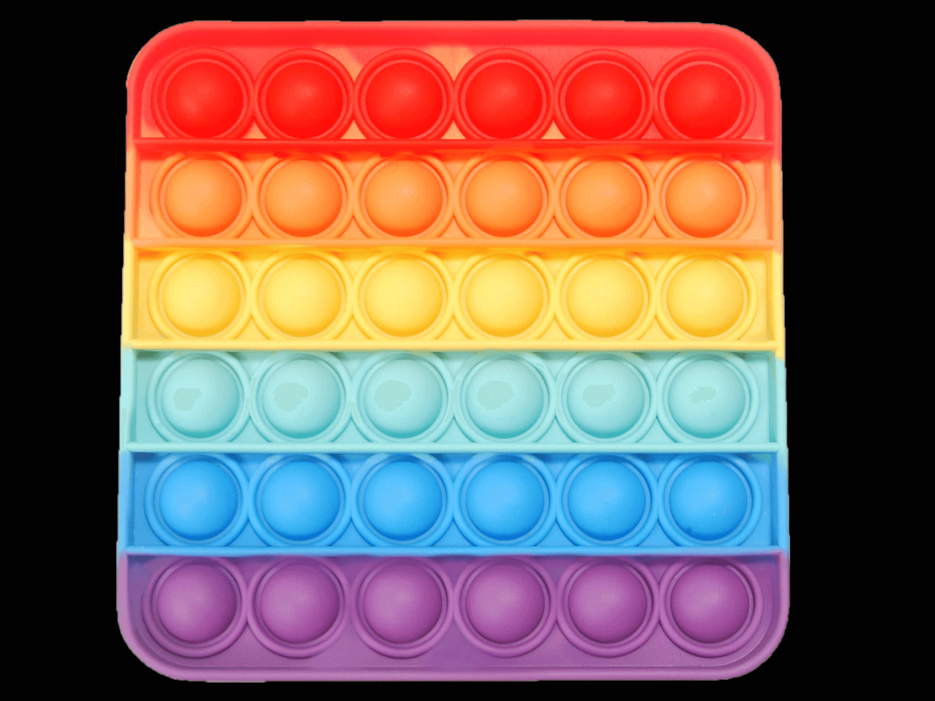 Square 桌布 壁紙 — 一個充滿活力的彩虹色 pop-it 減壓玩具，在黑色背景上有一排排彩色泡泡。
