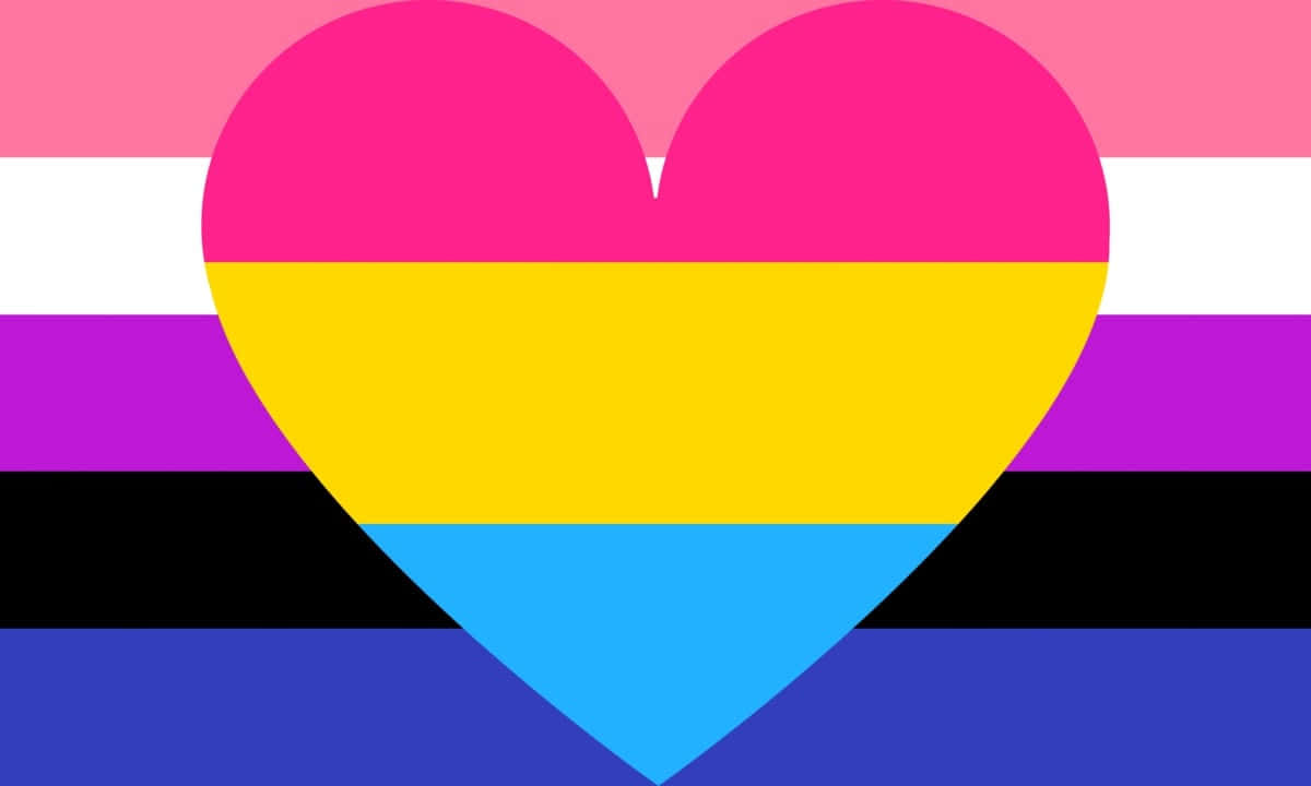 Genderfluid Flag 桌布 壁紙 — 一個充滿活力的心形圖案覆蓋在泛性戀旗幟上，旗幟上有大膽的粉紅、黃色和藍色條紋，背景是彩虹色。