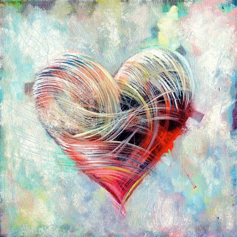 Heart Art 桌布 壁紙 — 一個充滿活力的抽象心形，以紅色、黃色和藍色的旋轉筆觸繪製在紋理淺藍色背景上。