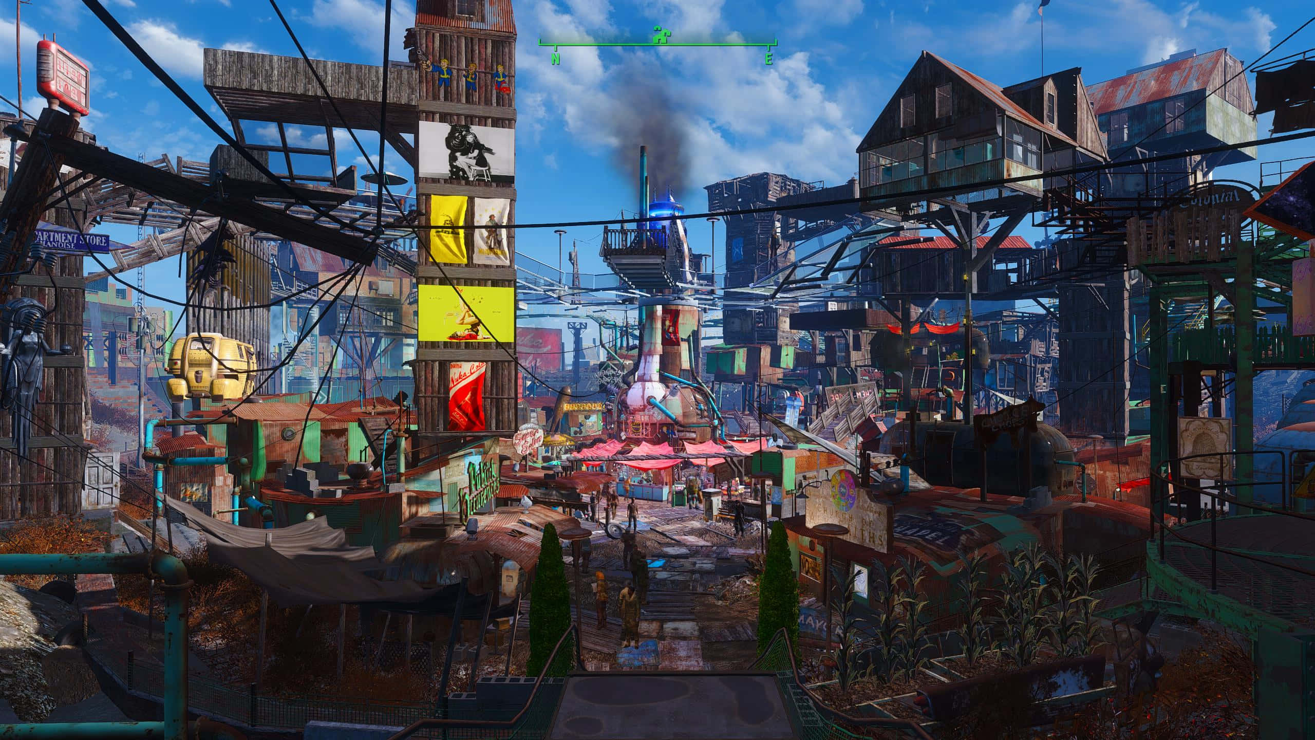 Diamond City 桌布 壁紙 — 一個充滿活力的末日後小鎮，擁有色彩繽紛的建築物、懸掛的電線和熙熙攘攘的街道，在明亮的藍天下。