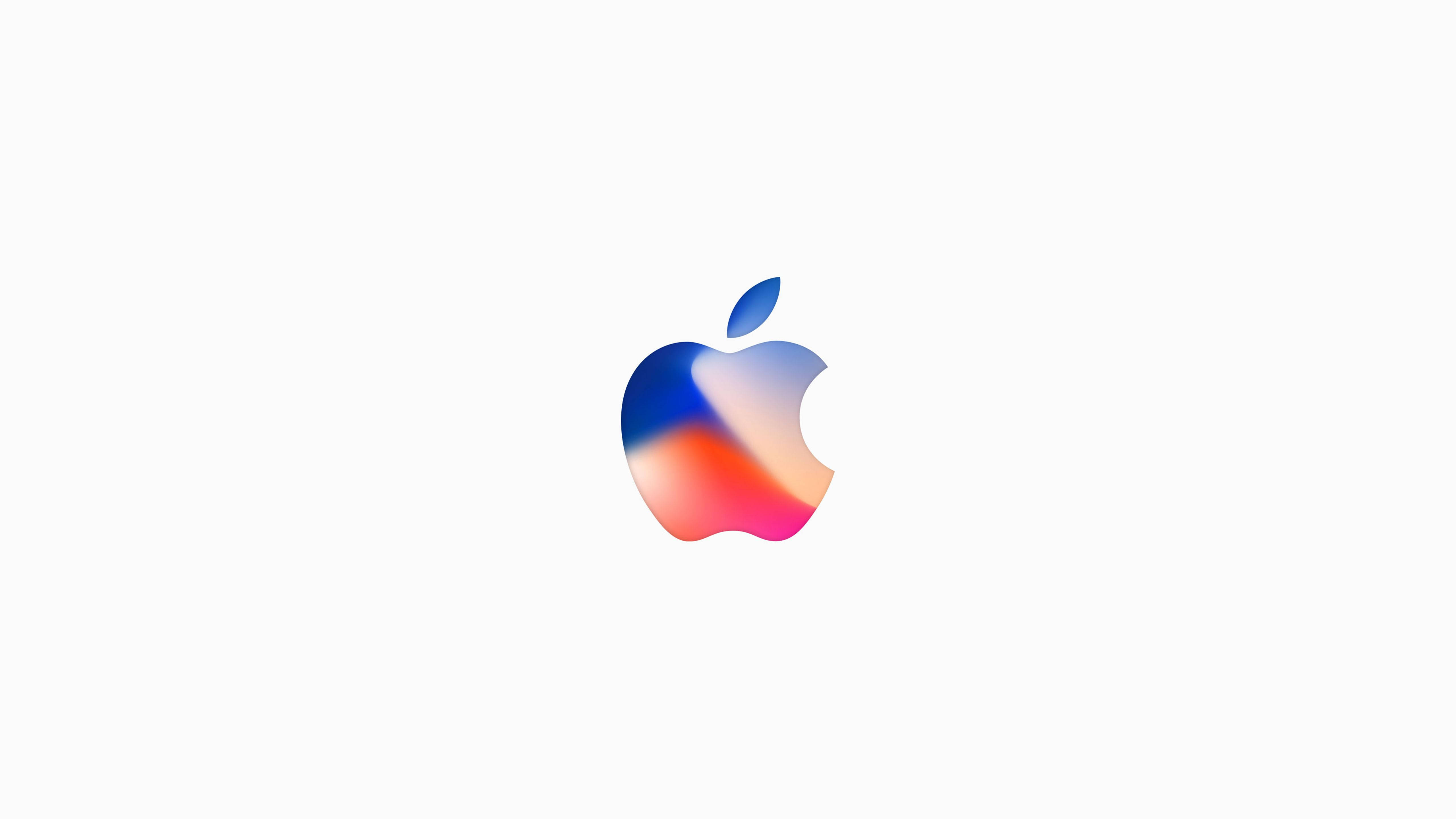 蘋果 桌布 壁紙 — 一個充滿活力的漸變Apple標誌，居中在乾淨的白色背景上，帶有藍色、粉紅色和橙色的色調。