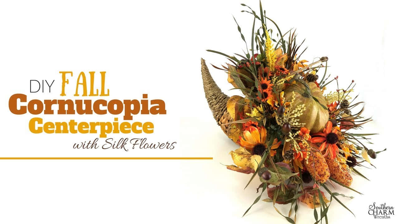 Fall Cornucopia 桌布 壁紙 — 一個充滿活力的秋季豐收角中心裝飾，滿載絲花、南瓜和秋葉，襯托在潔白的背景上。