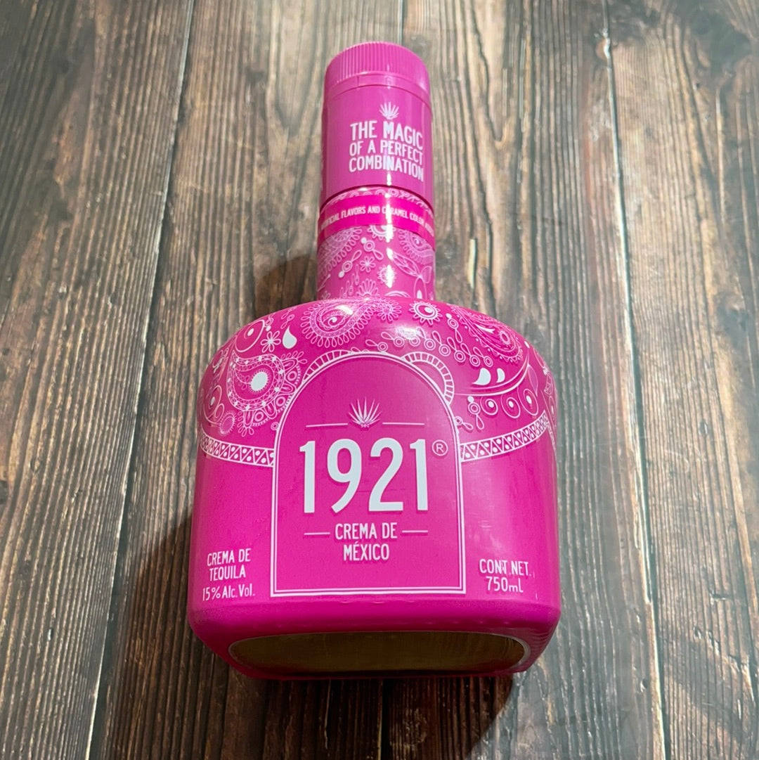 drinks 桌布 壁紙 — 一個充滿活力的粉紅色1921 Crema de Mexico龍舌蘭酒瓶，帶有白色華麗圖案，放置在質樸的深色木質表面上。