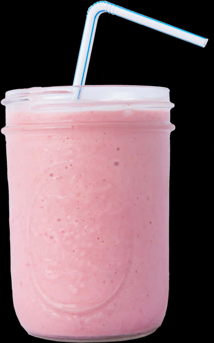 Smoothies 桌布 壁紙 — 一個充滿活力的粉紅色冰沙，裝在玻璃梅森罐中，配有藍色條紋吸管，背景為黑色。