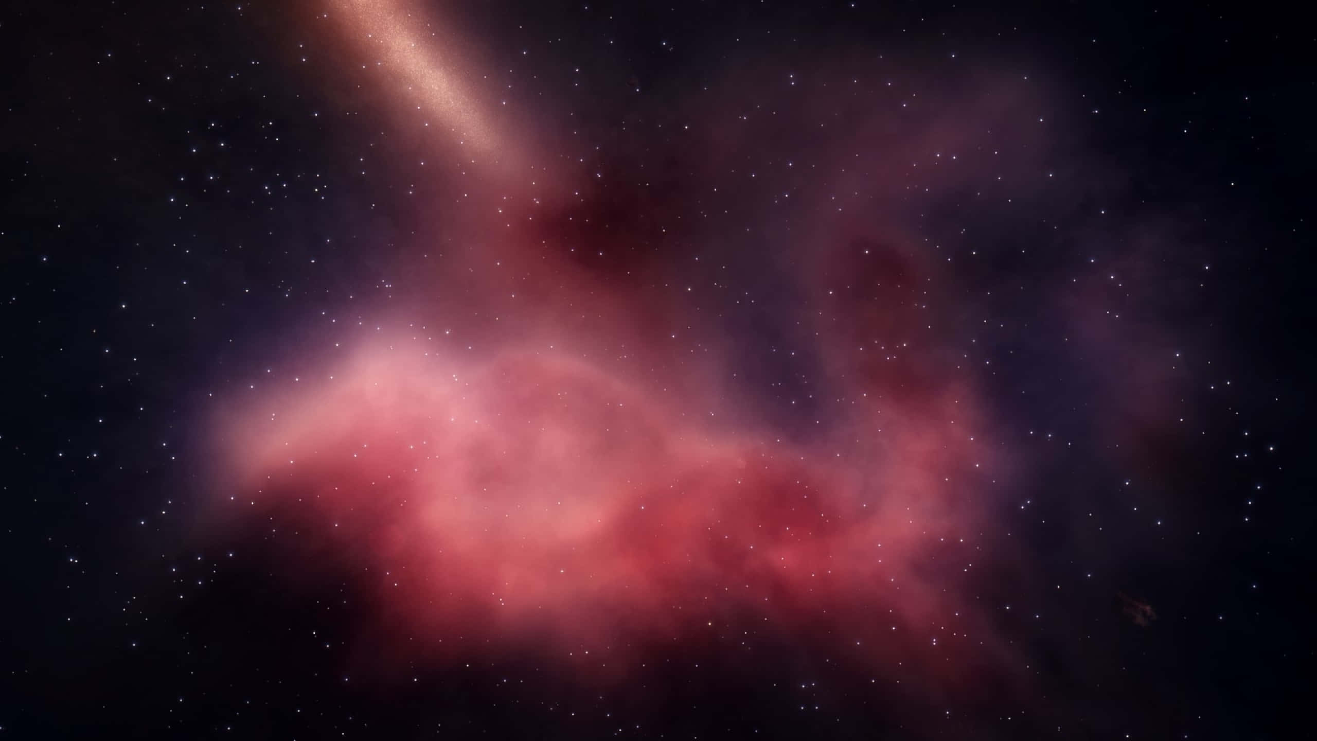 Constellation 桌布 壁紙 — 一個充滿活力的粉紅色和紫色星雲在星場中旋轉，左上角有一個發光的銀河臂。