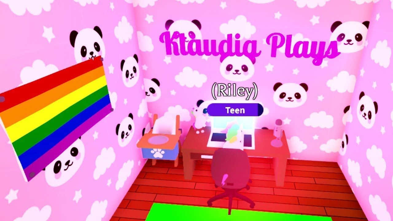 Roblox 桌布 壁紙 — 一個充滿活力的粉紅色房間，配有熊貓壁紙和彩虹旗，設有帶有「Ktäudia Plays」文字的遊戲設置。