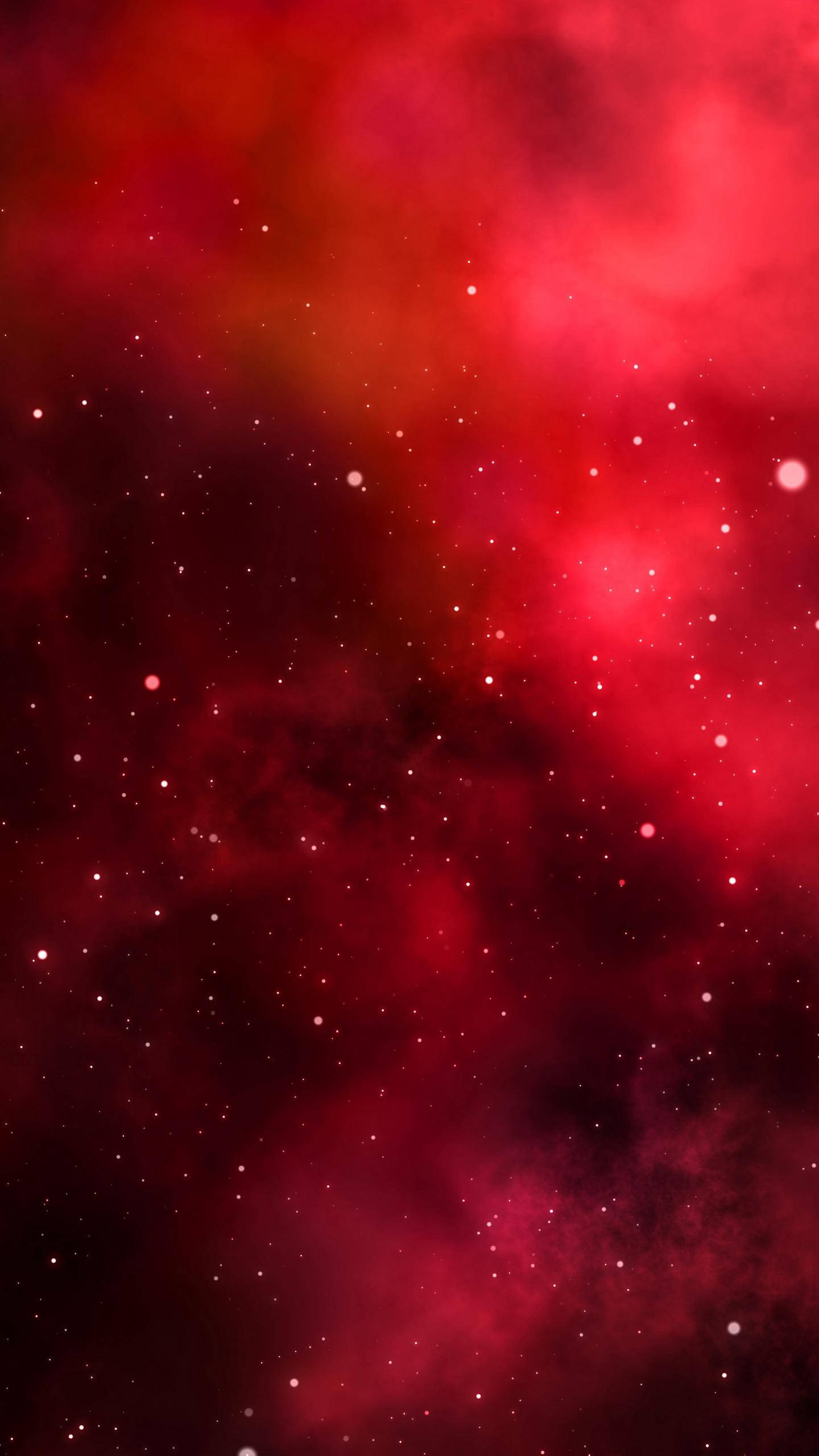 紅色 iPhone 桌布 壁紙 — 一個充滿活力的紅色星雲在宇宙虛空中旋轉，伴隨著閃爍的星星。