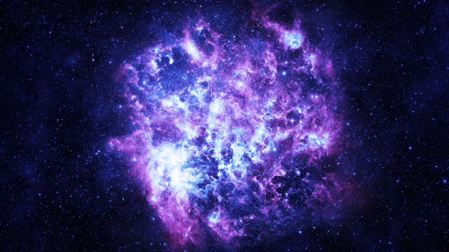 外太空 桌布 壁紙 — 一個充滿活力的紫色和藍色星雲，在深邃的宇宙虛空中旋轉，帶有發光的氣體和散落的星星。