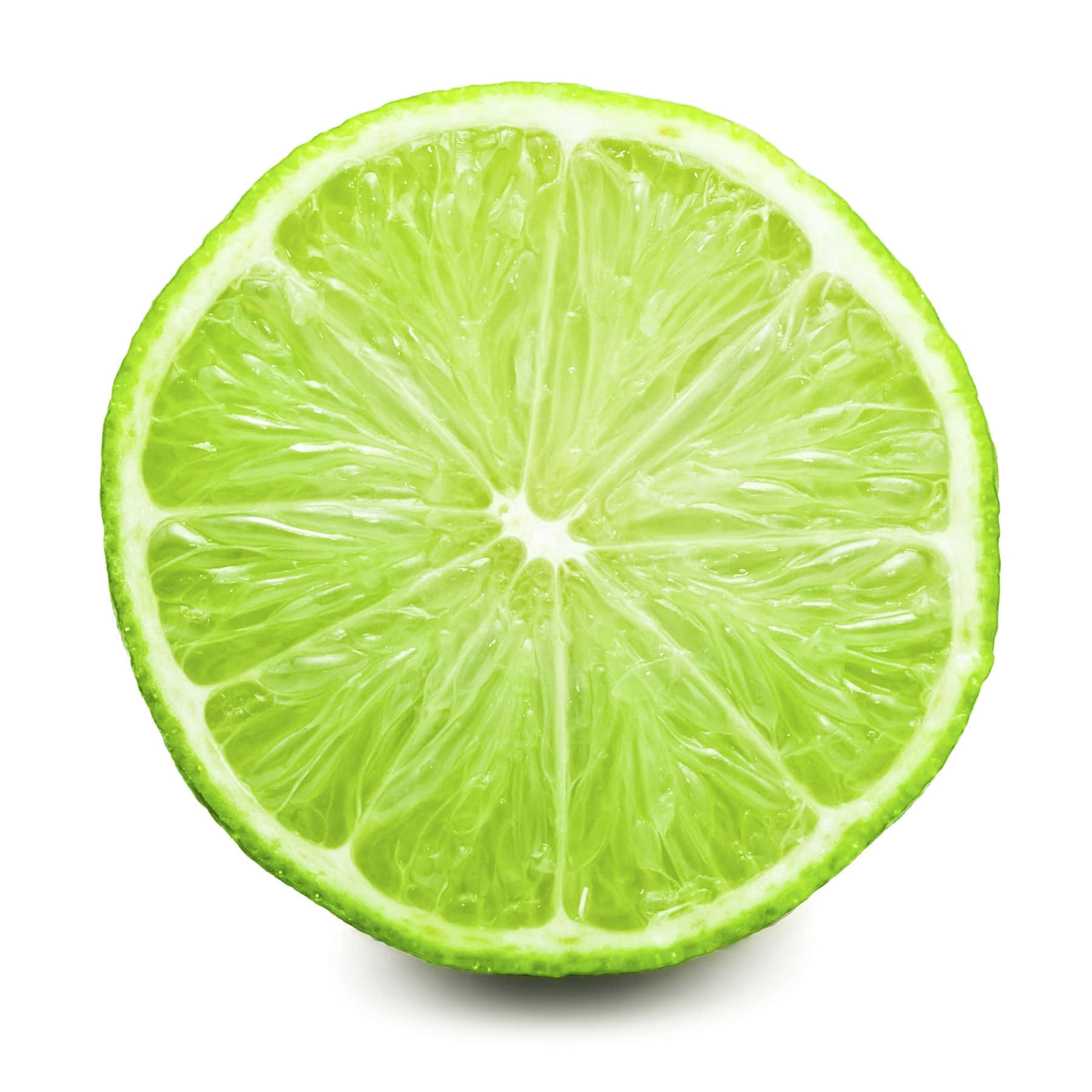 Lime 桌布 壁紙 — 一個充滿活力的萊姆橫切面，在純白背景上展現出多汁的果瓣。