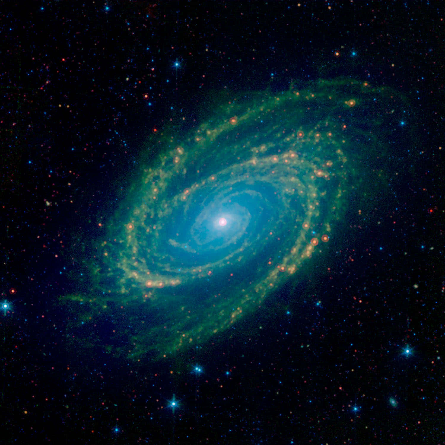 Nasa Galaxy 桌布 壁紙 — 一個充滿活力的螺旋星系，帶有發光的藍色核心和綠色旋臂，在黑暗的宇宙背景下，在五彩繽紛的星場中旋轉。