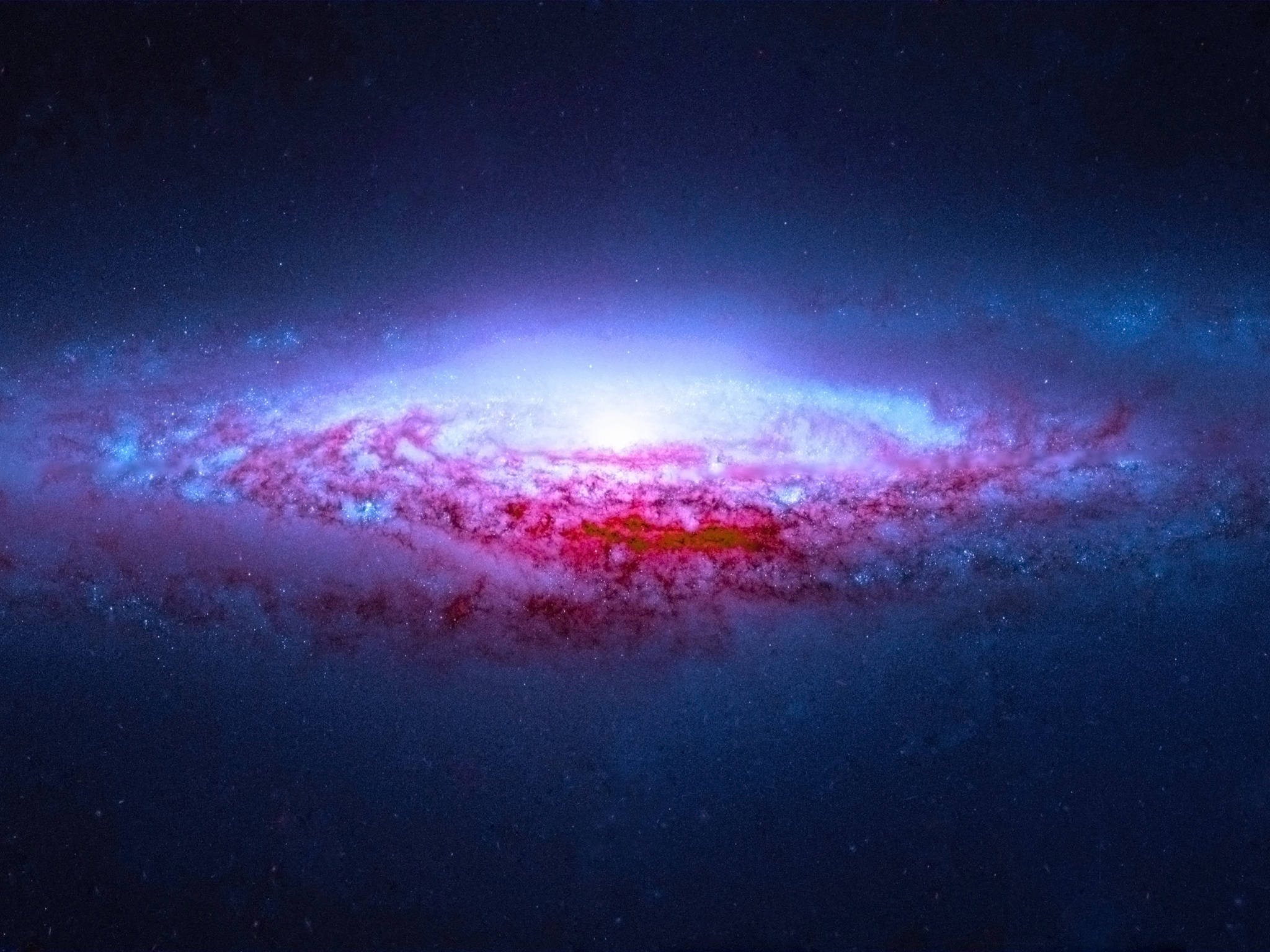 Cosmos 桌布 壁紙 — 一個充滿活力的螺旋星系在繁星點點的宇宙背景下閃耀著粉紅色和藍色的星雲。