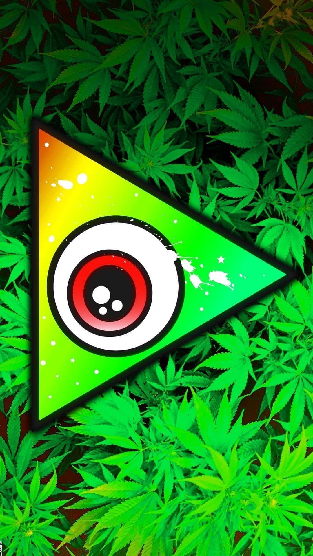 迷幻 桌布 壁紙 — 一個充滿活力的迷幻三角形，中央有一個風格化的眼睛圖案，周圍環繞著茂密的綠色大麻葉。