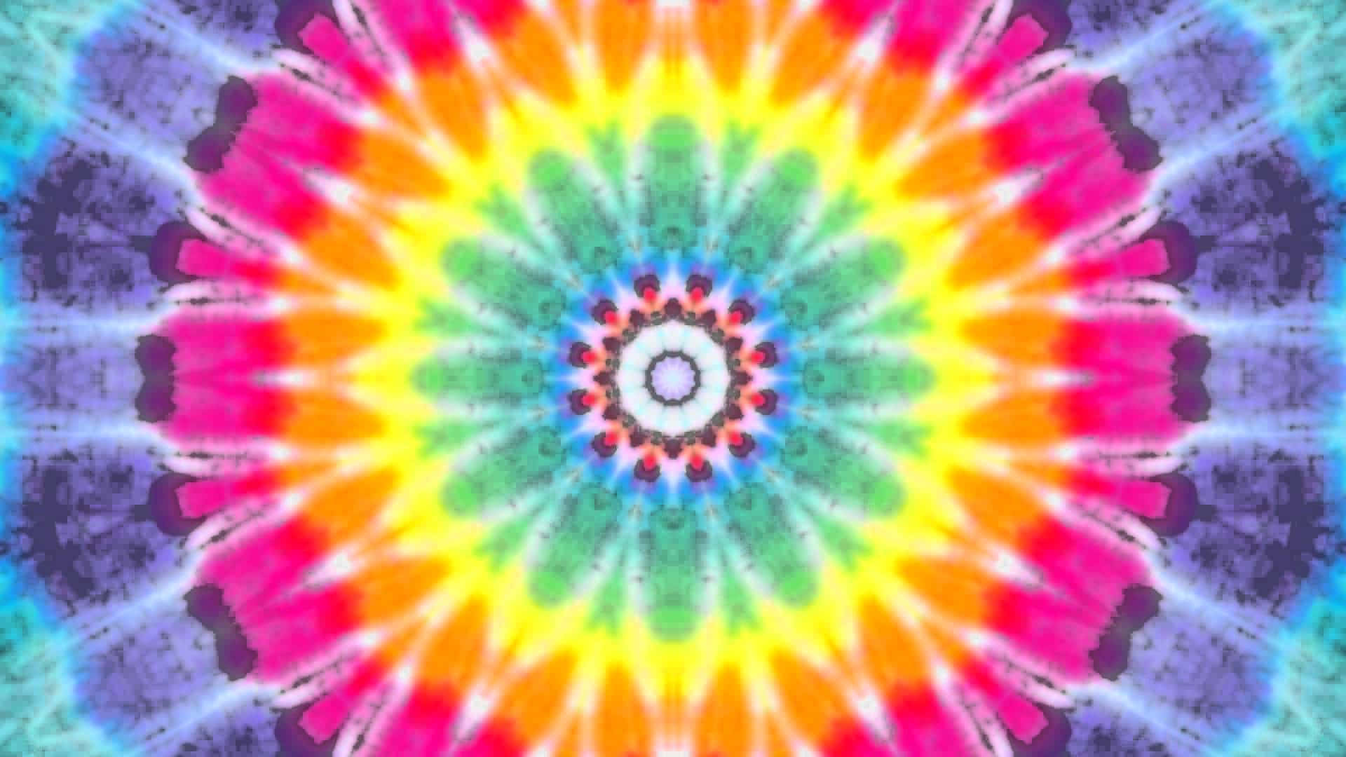 Pretty Tie Dye 桌布 壁紙 — 一個充滿活力的迷幻紮染曼陀羅，從中央白色核心對稱地散發出霓虹色彩。