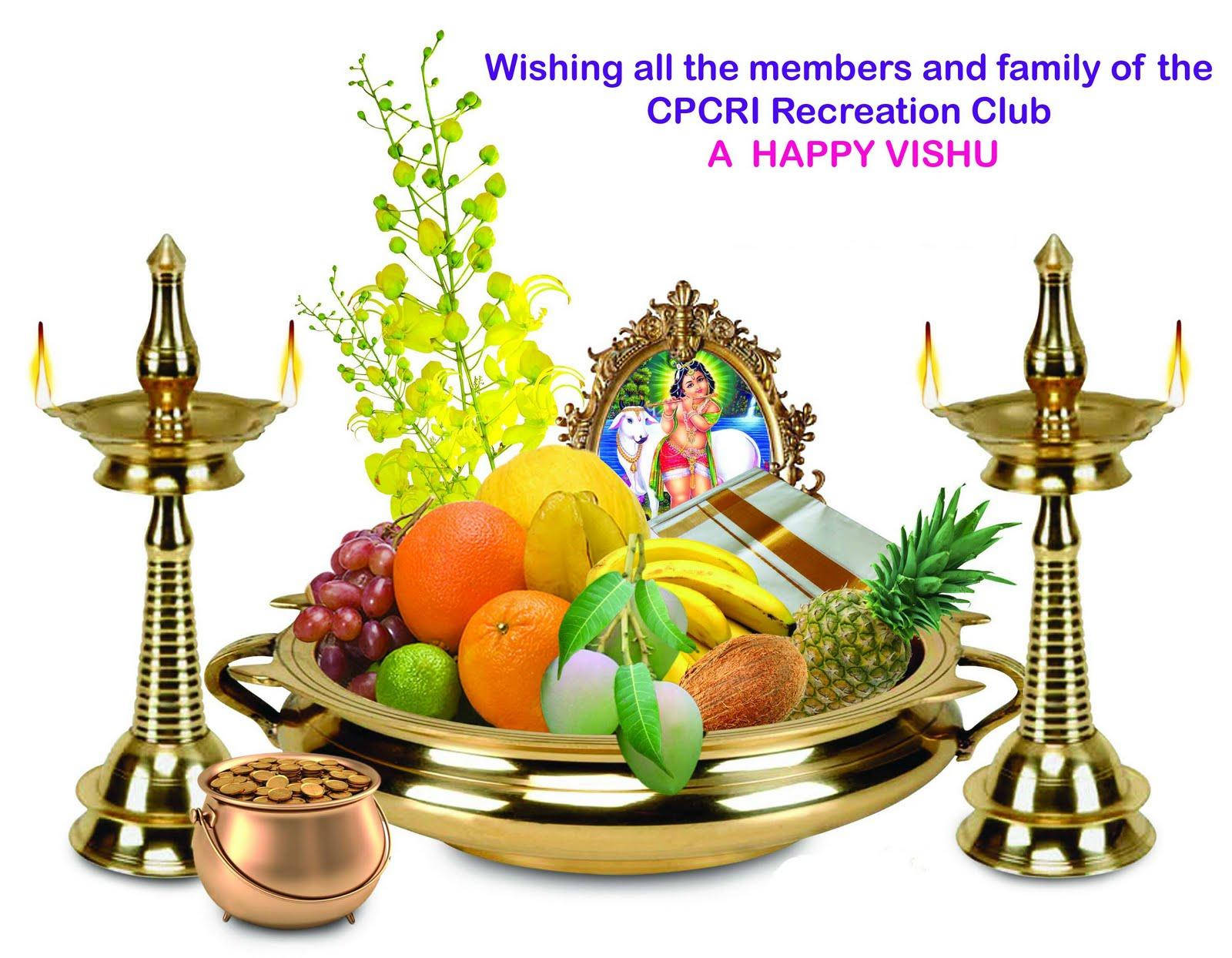 Vishu 桌布 壁紙 — 一個充滿節日氣氛的Vishu托盤，上面放滿色彩繽紛的水果、蠟燭和神像，周圍環繞著金色黃銅物品。