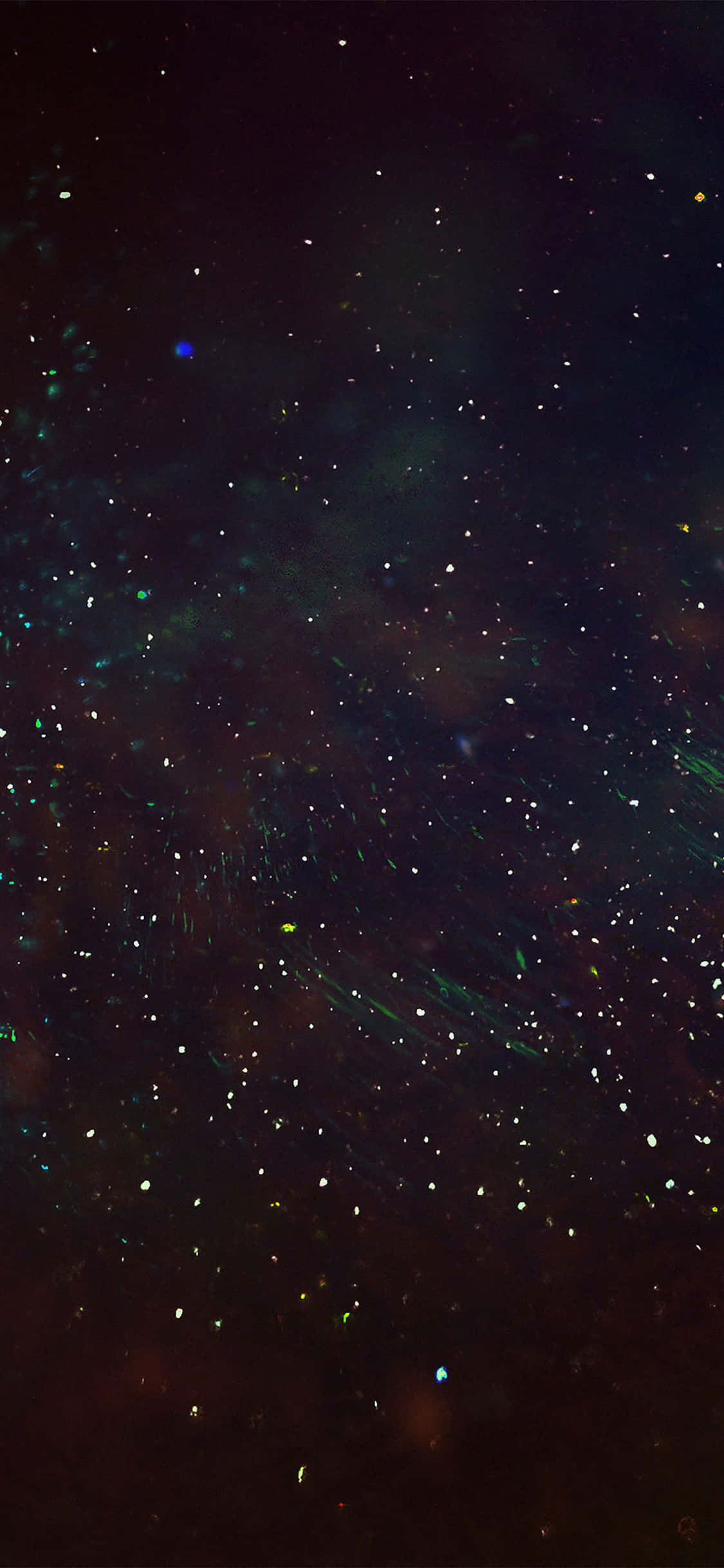 Minimalist Pattern 桌布 壁紙 — 一個充滿閃爍星星和發光星雲的宇宙空間，呈現深紫色、綠色和藍色調。