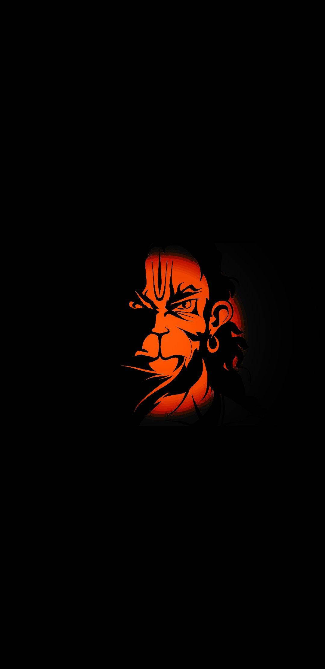 lord hanuman HD 桌布 壁紙 — 一個兇猛的動漫角色臉部在漆黑的背景下散發出火橙色的光芒。