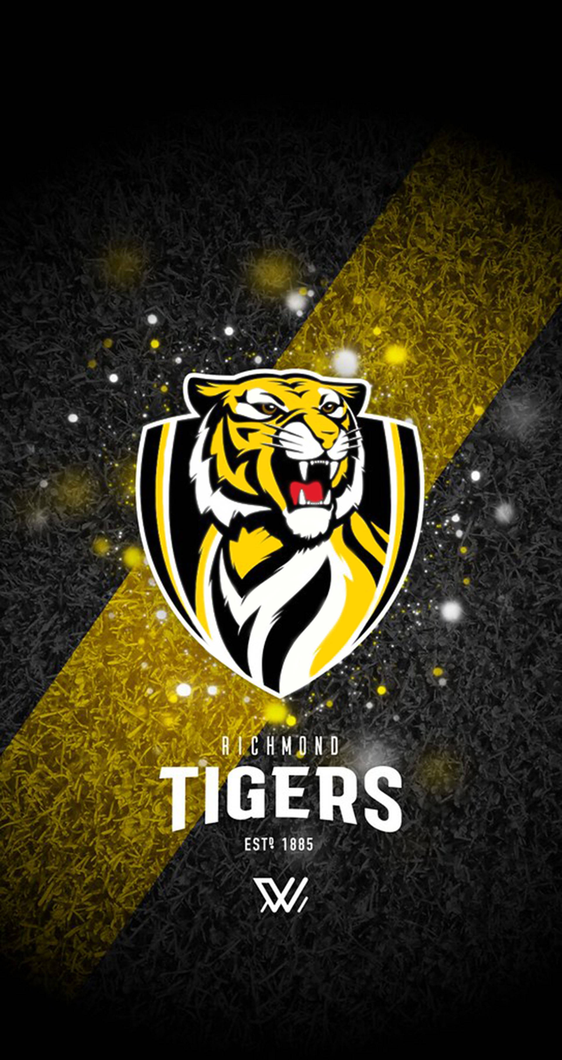 Afl 桌布 壁紙 — 一個兇猛的黑、黃、白色老虎標誌在帶有對角金色條紋和閃爍粒子的深色紋理背景上發光。