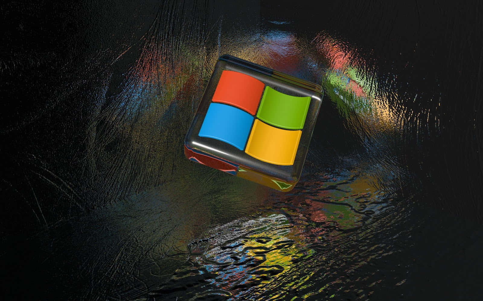 標誌 桌布 壁紙 — 一個光滑的Windows標誌立方體漂浮在黑暗潮濕的表面上，反射出鮮豔的彩虹色。