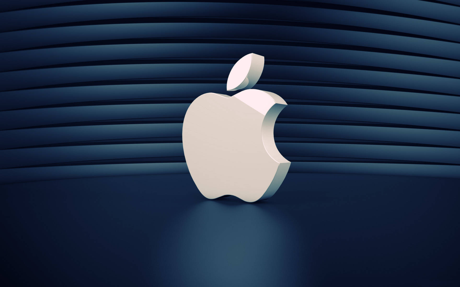 Screen Saver 桌布 壁紙 — 一個光滑的白色Apple標誌放置在帶有水平紋理的深藍色彎曲表面上，光線柔和。
