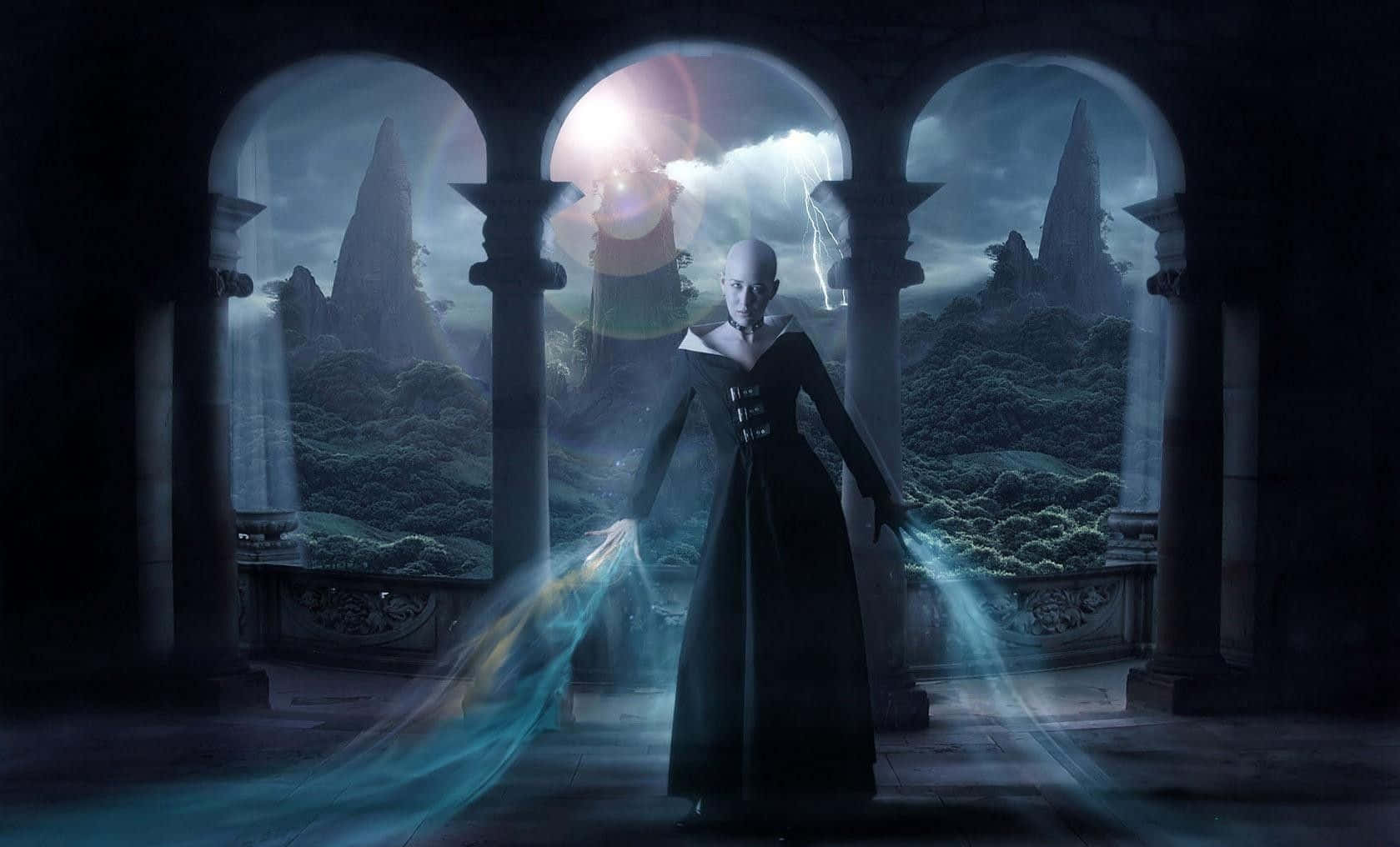 Evil Witch 桌布 壁紙 — 一個光頭人物穿著黑色長袍站在哥德式拱門中，在暴風雨的山景背景下引導發光的藍色能量。