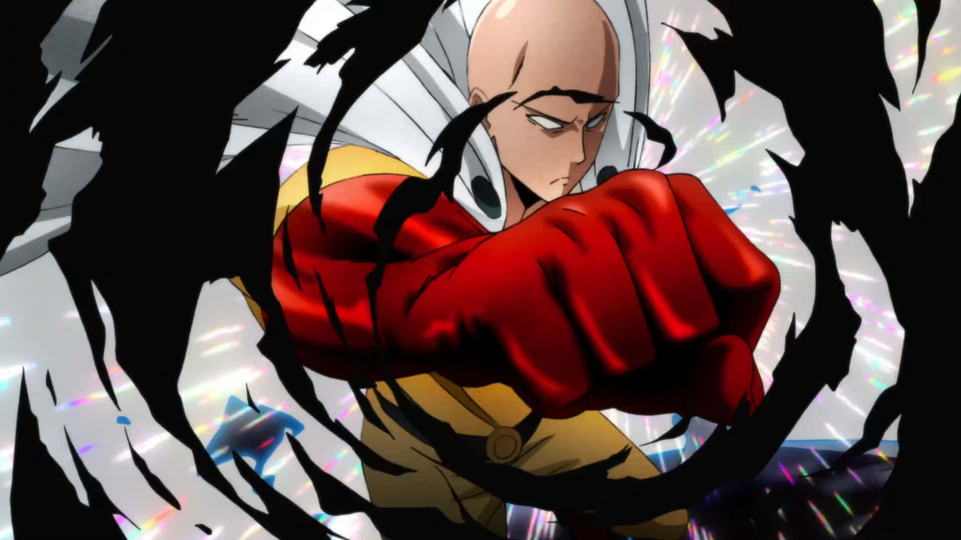 One Punch Man Season 2 桌布 壁紙 — 一個光頭動漫英雄身穿紅黃色服裝，穿過破碎的黑白背景向前出拳，伴隨著發光的粒子。