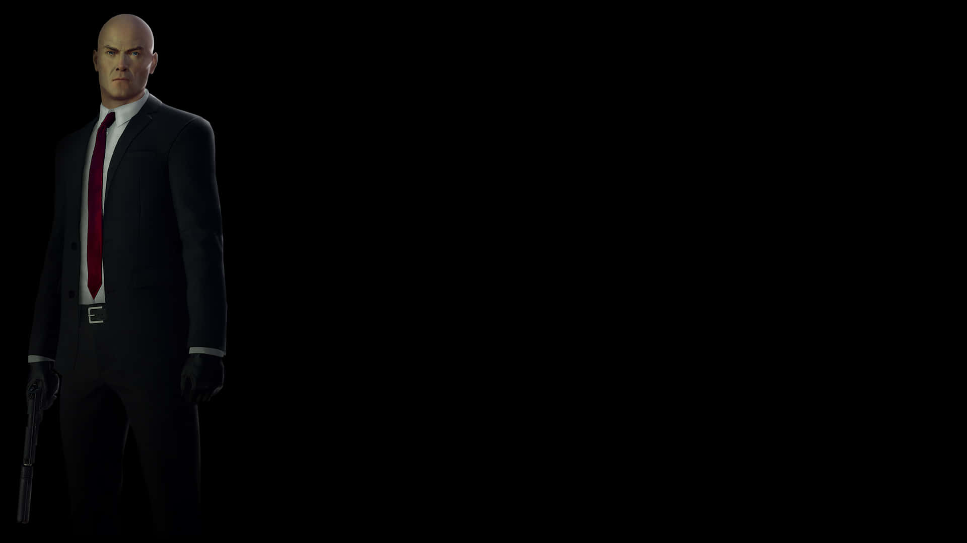 Hitman 2 桌布 壁紙 — 一個光頭男人穿著深色西裝和紅色領帶，站在黑色背景前，手持手槍。