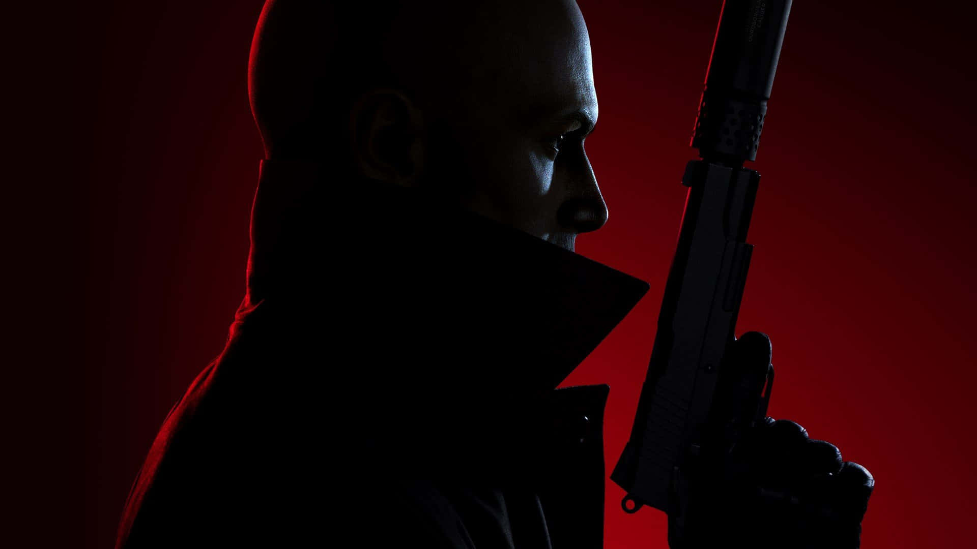 Hitman 2 桌布 壁紙 — 一個光頭男子身穿深色外套，在發光的紅色背景下手持手槍，形成戲劇性的剪影。