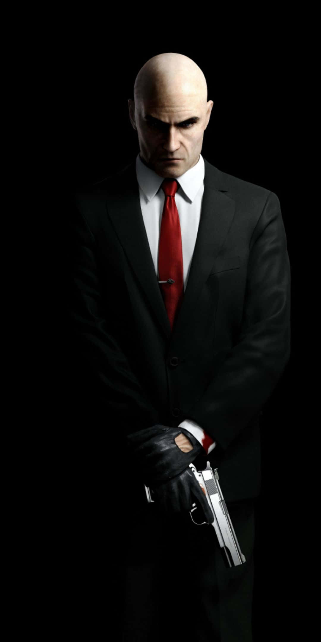Pixel 3 Hitman Absolution 桌布 壁紙 — 一個光頭男子身穿黑色西裝和紅色領帶，在純黑色背景前以強烈燈光手持銀色手槍。