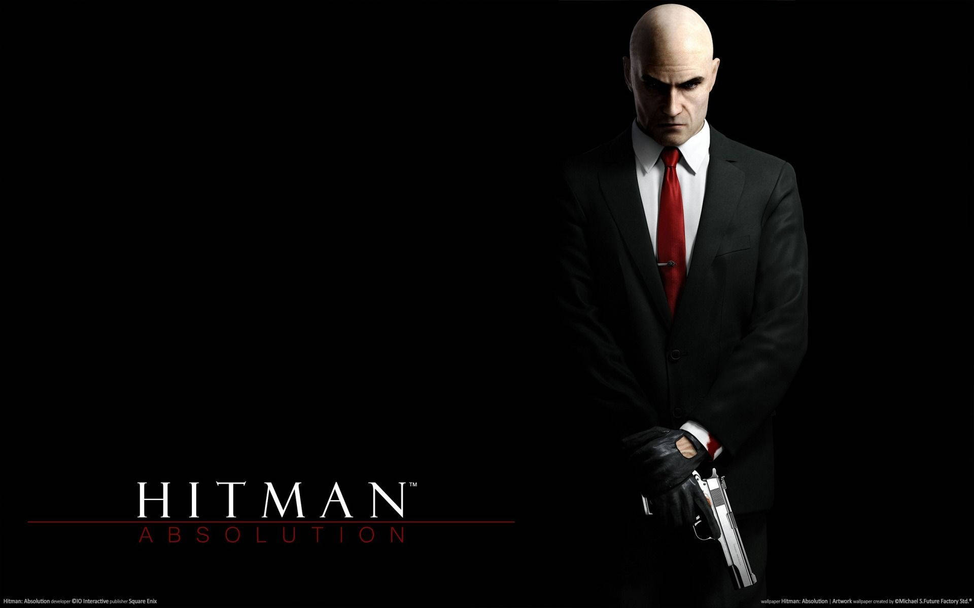 hitman iPhone 桌布 壁紙 — 一個光頭男子身穿黑色西裝和紅色領帶，在黑色背景上手持手槍，並帶有「Hitman Absolution」文字。