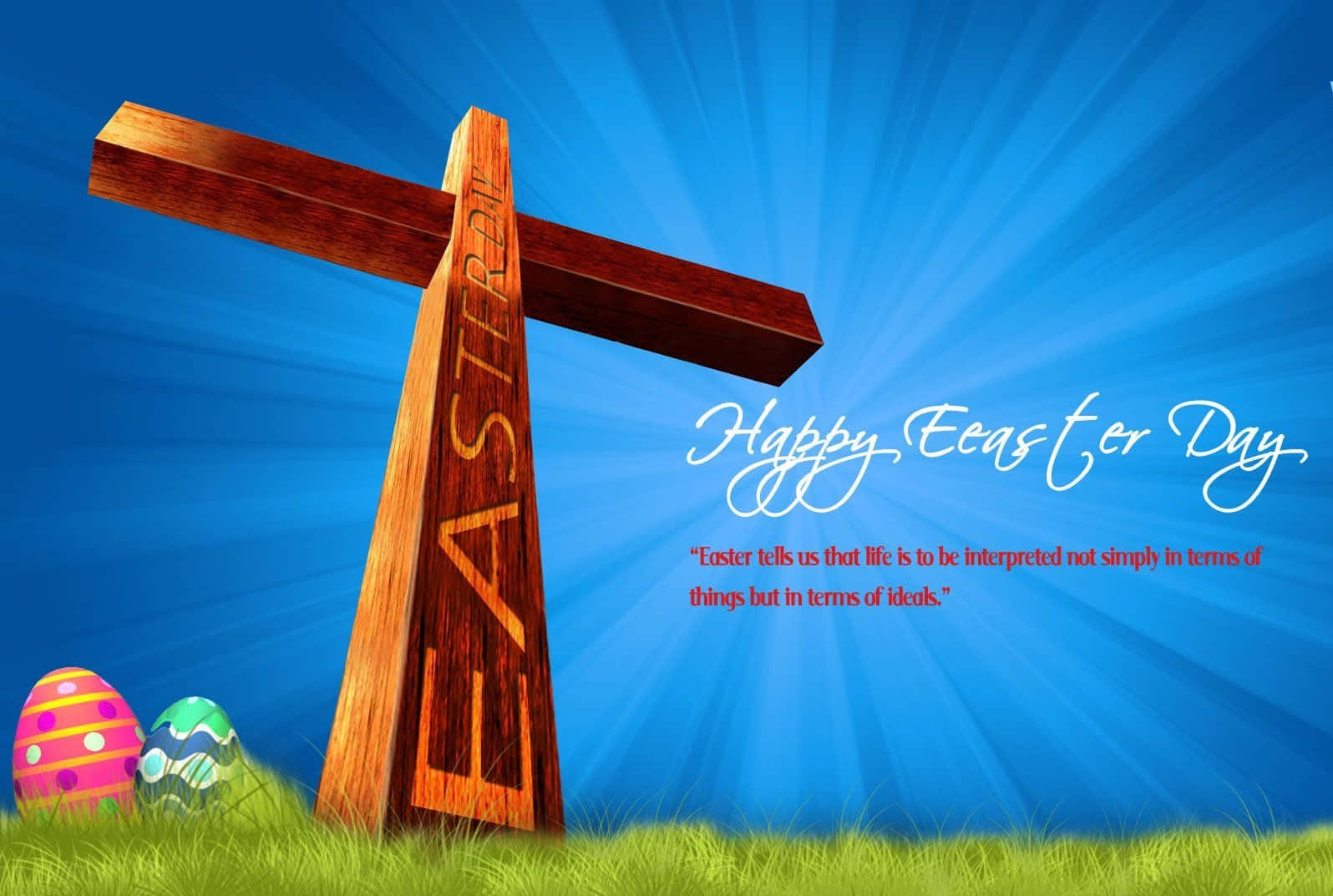 復活節 桌布 壁紙 — 一個刻有「EASTER」的木製十字架矗立在綠色草地上，旁邊是色彩繽紛的復活蛋，背景是燦爛的藍天。