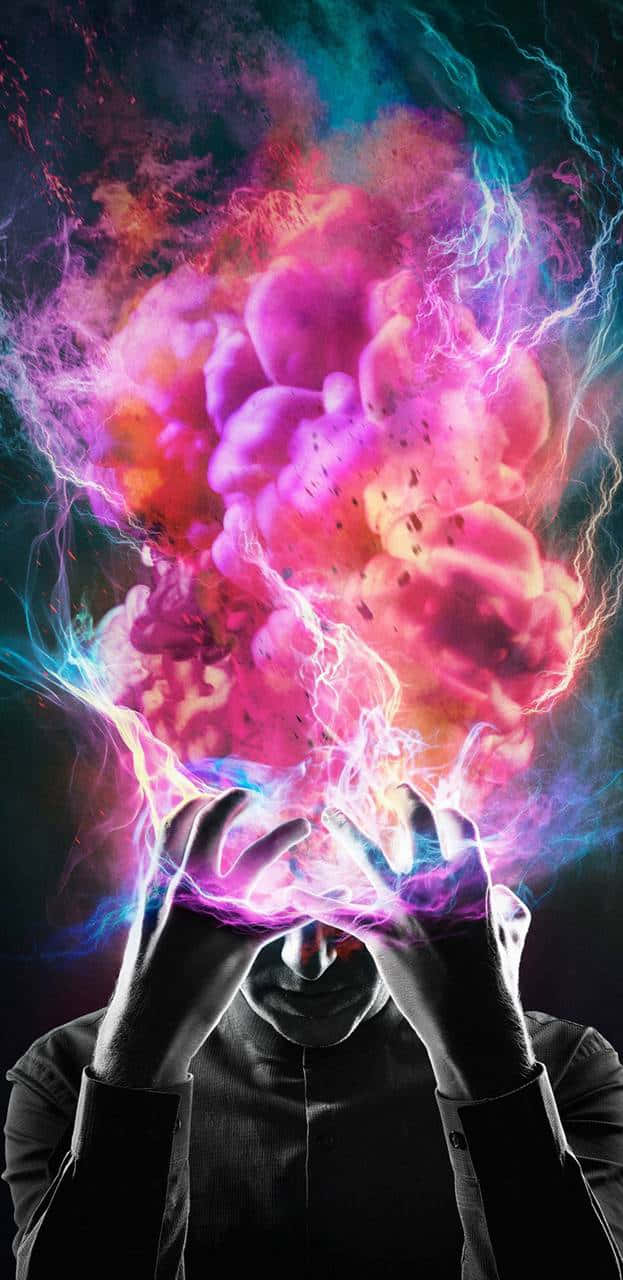 Mind-blowing 桌布 壁紙 — 一個剪影人物手持發光的粉紅色和藍色能量爆炸，伴隨著劈啪作響的閃電，高舉過頭頂。