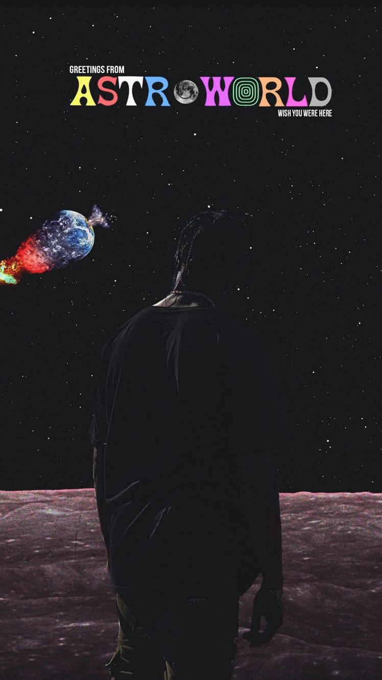 Astroworld 桌布 壁紙 — 一個剪影人物站在月球表面，凝視著一顆色彩繽紛的行星在星空下飛馳，下方有「Greetings from Astro World」文字。