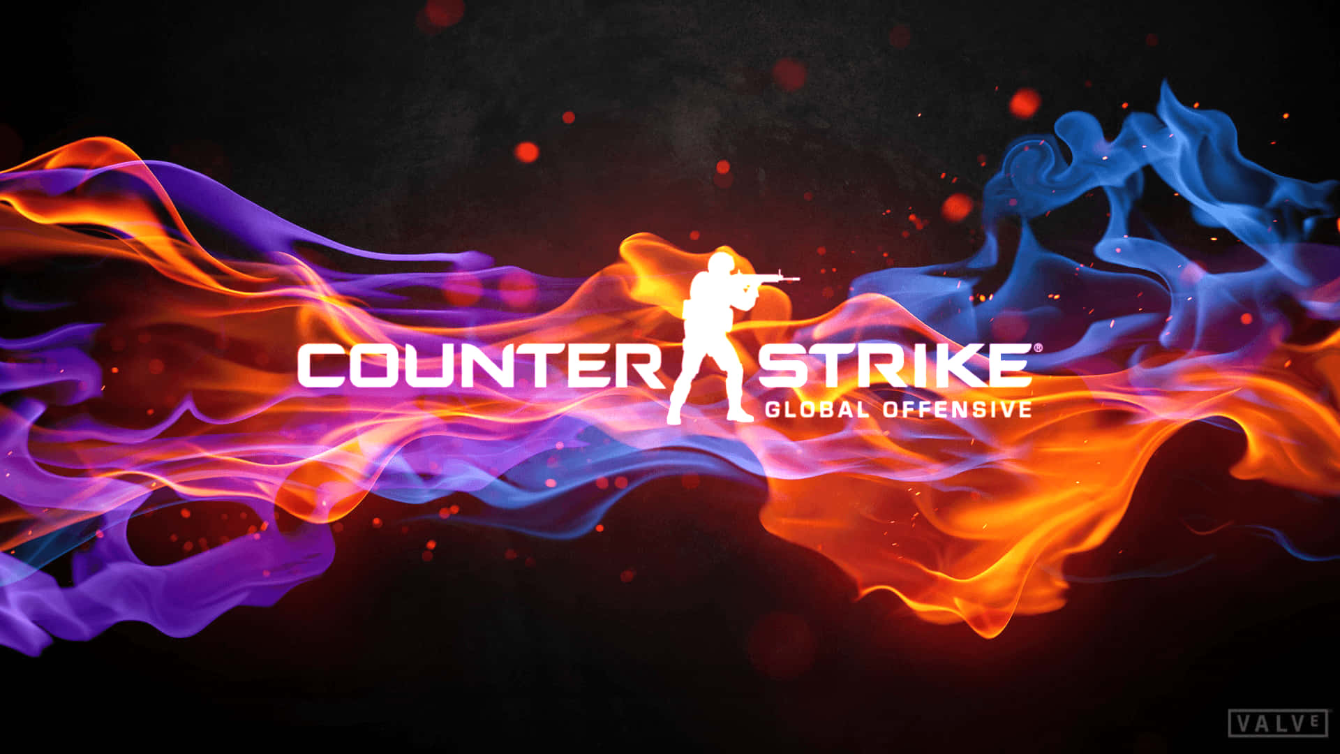 Counterstrike 桌布 壁紙 — 一個剪影士兵瞄準步槍，背景是橙色、藍色和紫色火焰的動態漩渦，帶有發光粒子。
