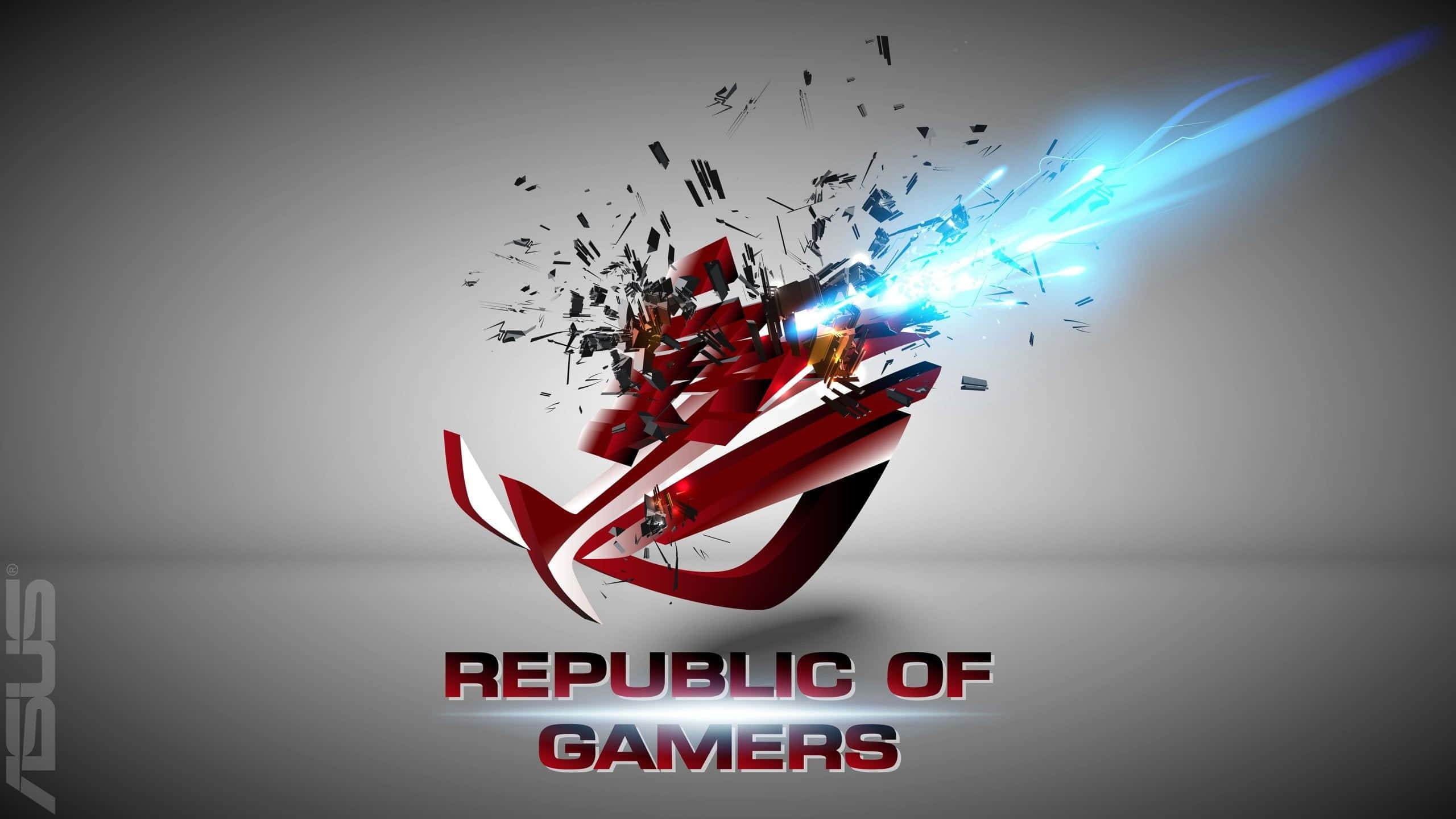 ASUS 桌布 壁紙 — 一個動態的紅色 ROG 標誌在灰色背景上被藍色能量衝擊炸成碎片。