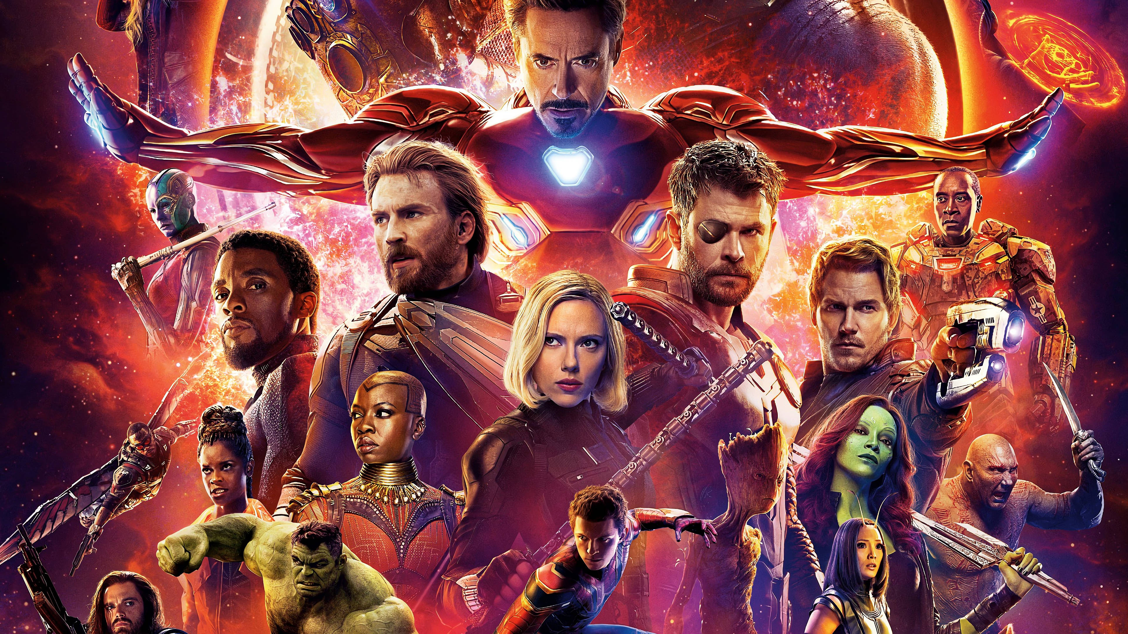 Avengers Assemble 桌布 壁紙 — 一個動態的超級英雄組合在宇宙爆炸背景下英勇地擺出姿勢，背景是火紅和橙色。