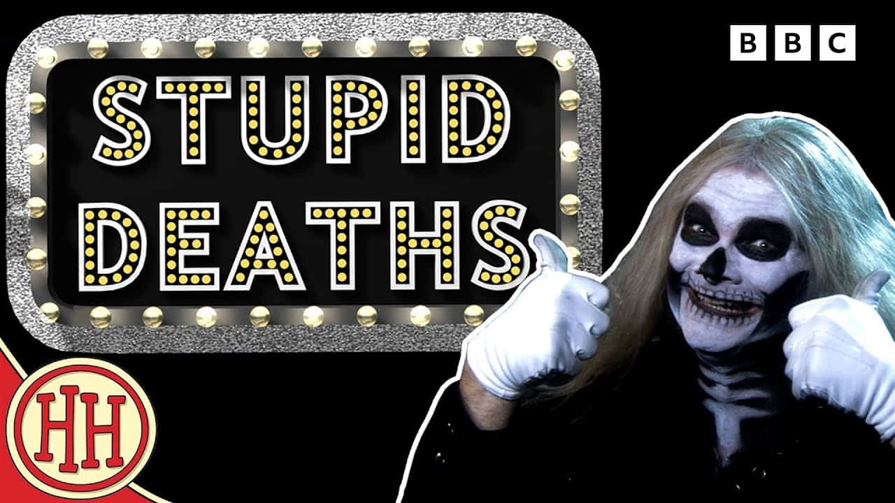 Stupid 桌布 壁紙 — 一個化骷髏妝的人在發光的「STUPID DEATHS」招牌旁邊豎起拇指。