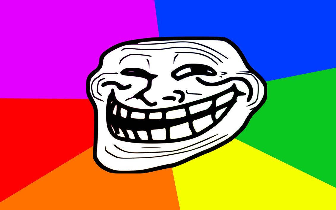 Troll 桌布 壁紙 — 一個卡通巨魔臉，咧嘴大笑，背景是鮮豔的彩虹。